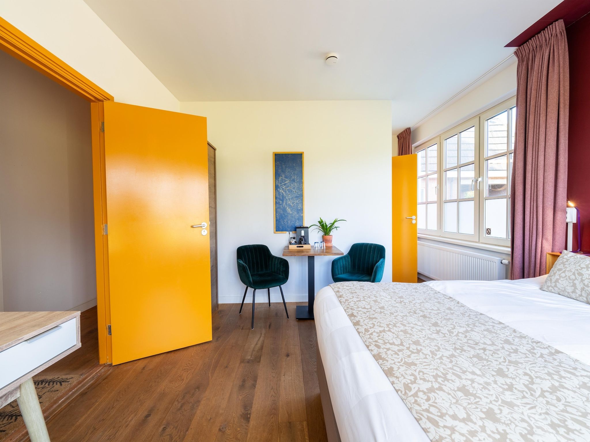 Een slaapkamer van Landhuis Hezenes in Diever