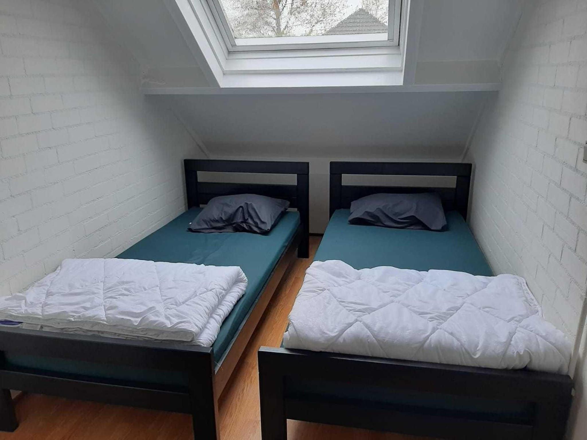 Een slaapkamer van Schoneveld 121 Duinroos Breskens in Breskens