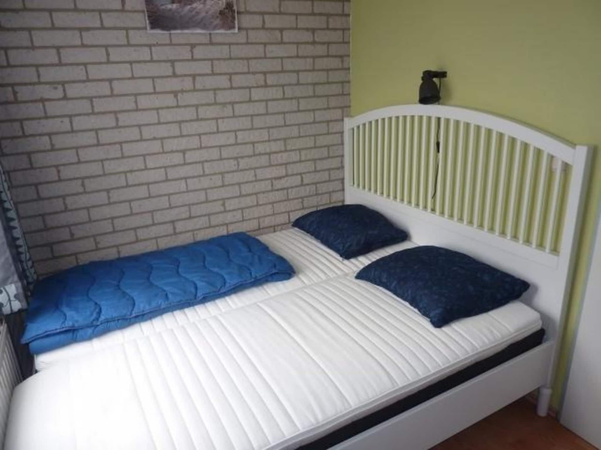 Een slaapkamer van Schoneveld 367 Strandparel Breskens in Breskens