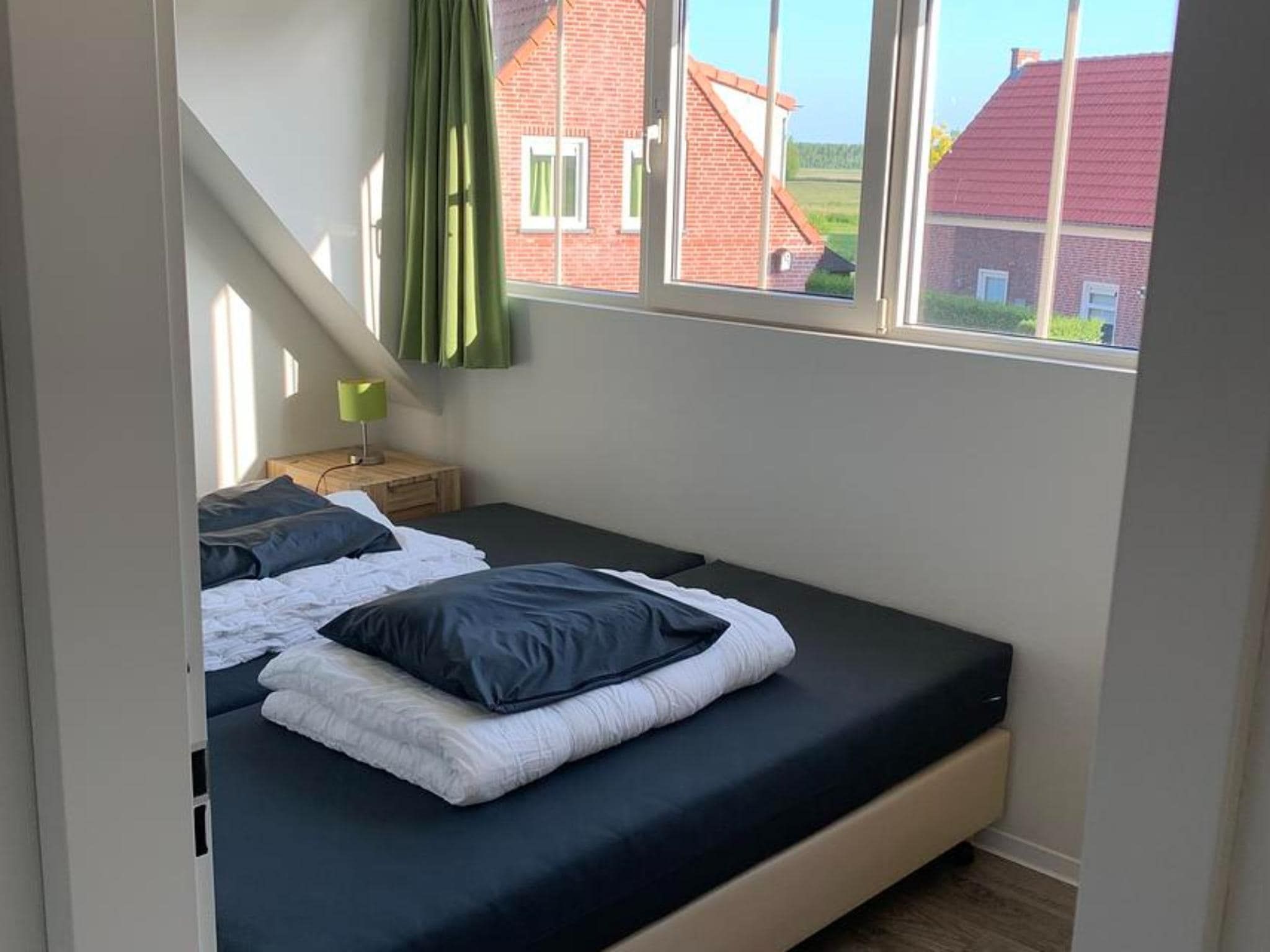 Een slaapkamer van Landgoed de Lente 34 Krokus Breskens in Breskens