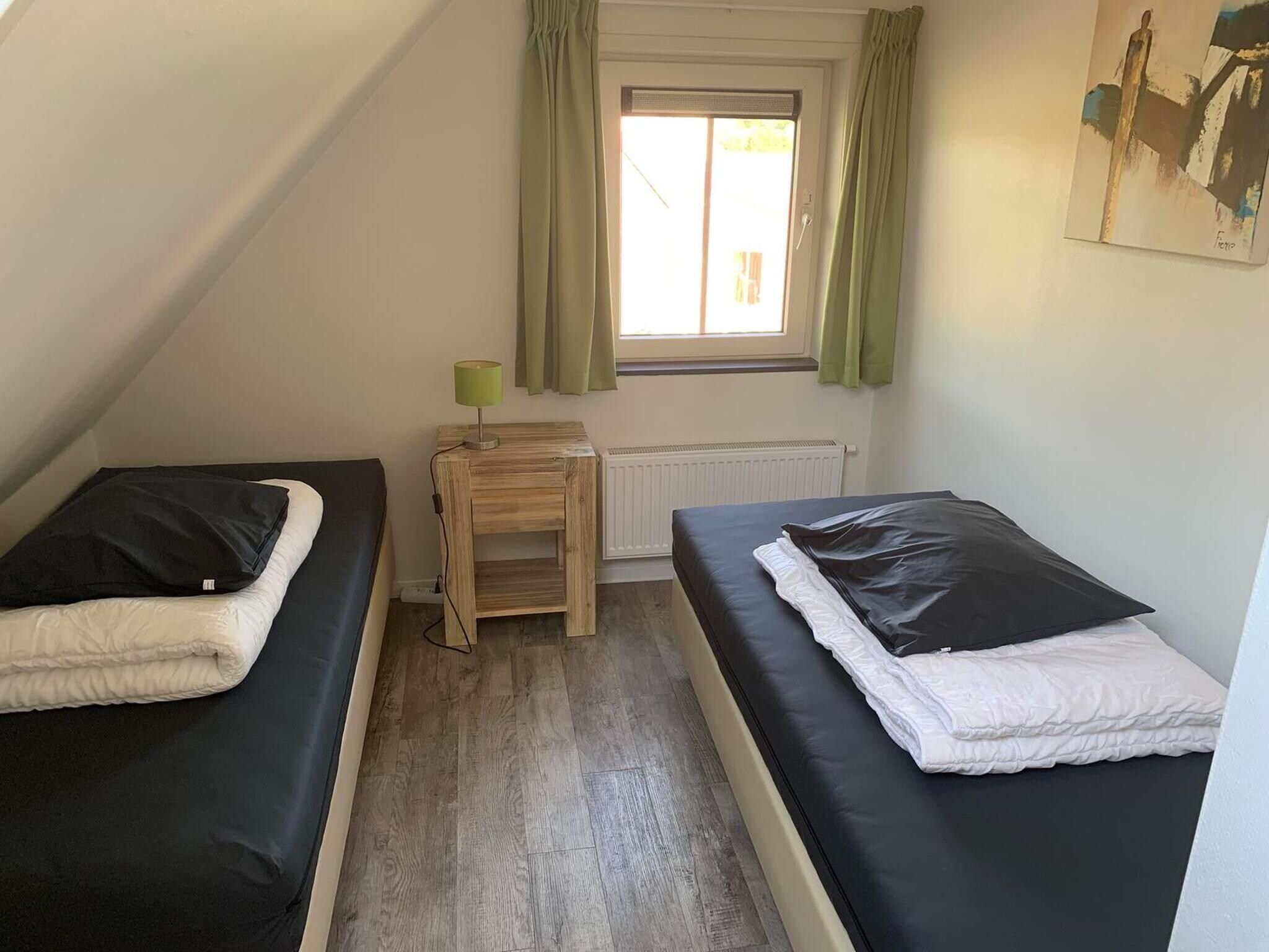 Een slaapkamer van Landgoed de Lente 34 Krokus Breskens in Breskens