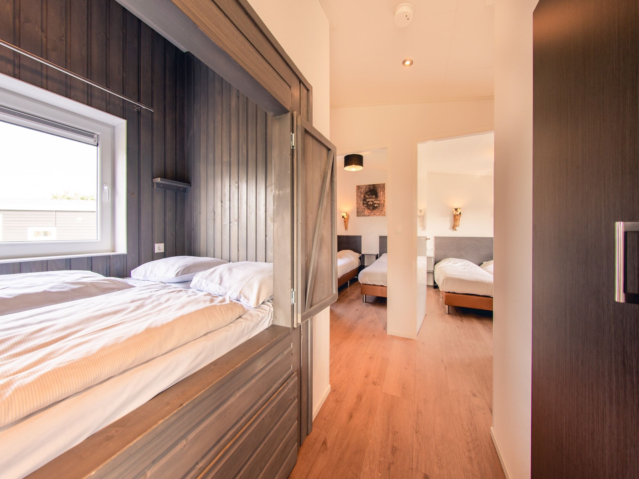 Een slaapkamer van Raccoon Lodge in Slagharen