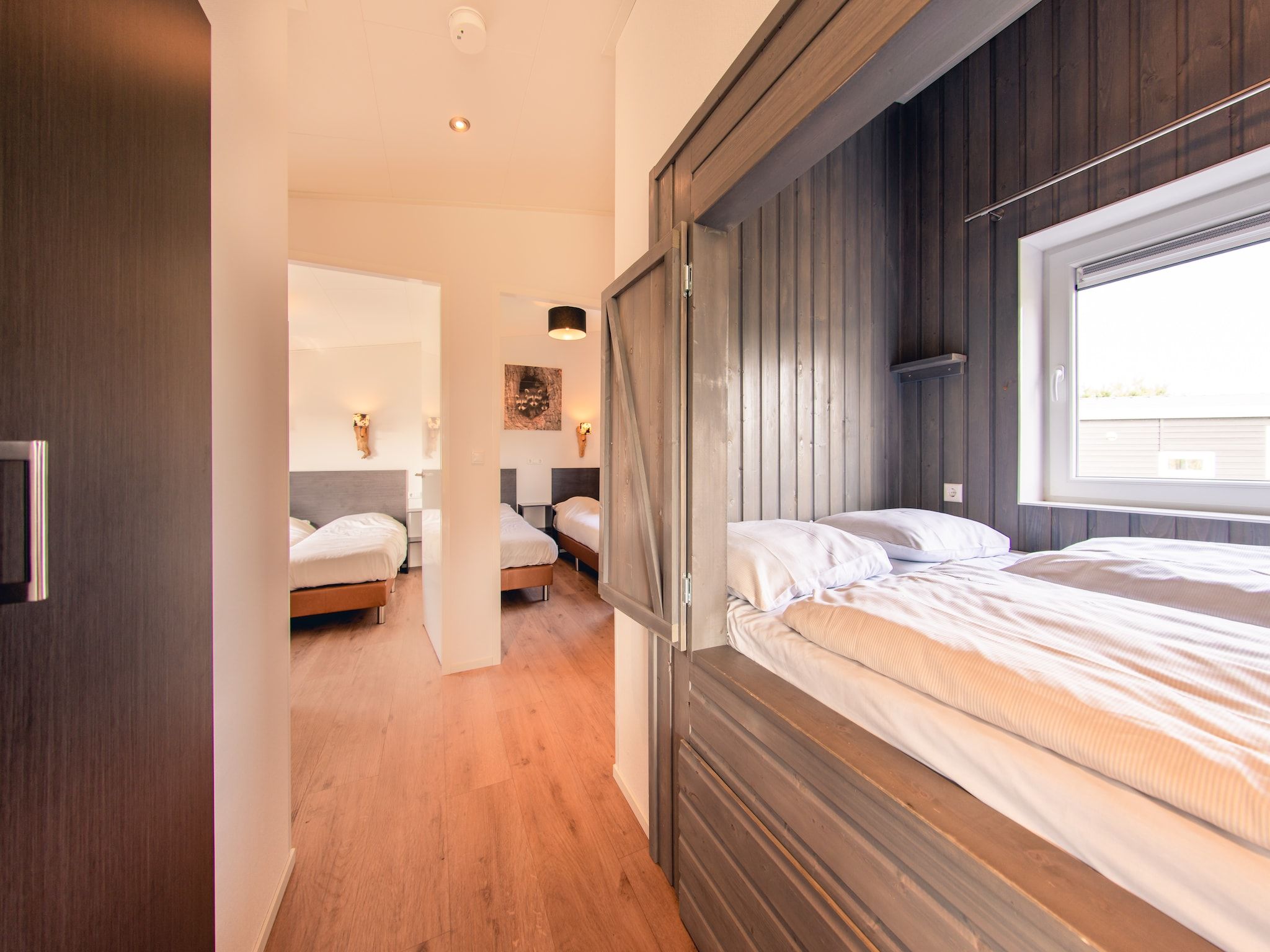 Een slaapkamer van Raccoon Lodge in Slagharen