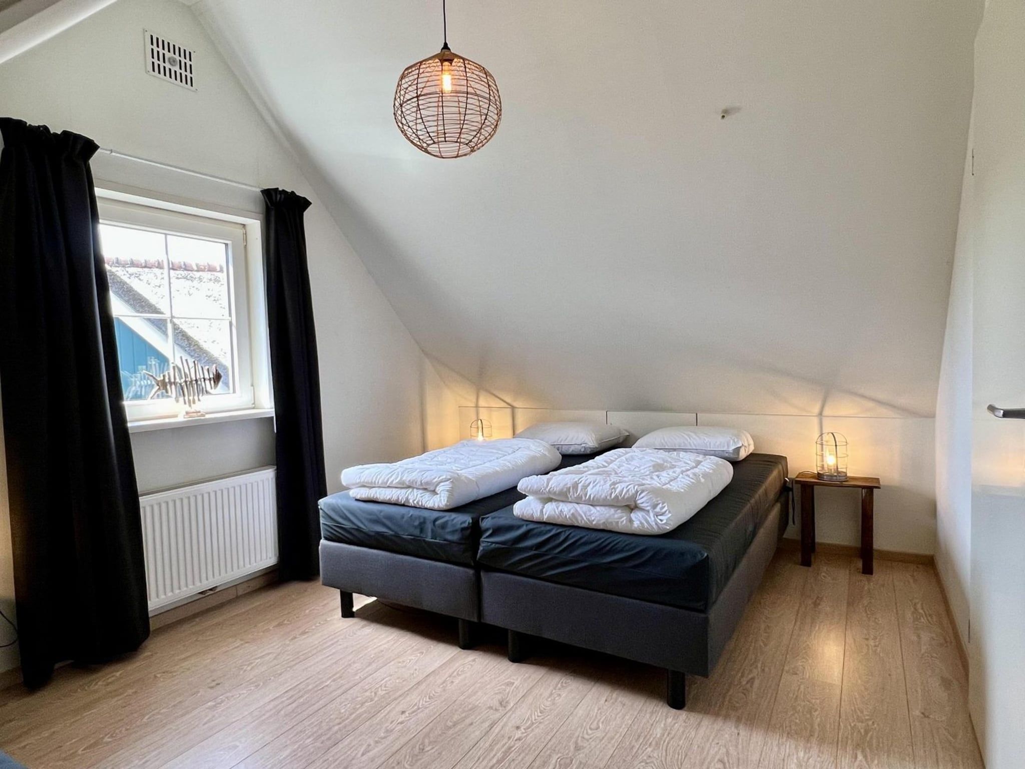 Een slaapkamer van Anzelhoef apartment West in Sint Maartenszee