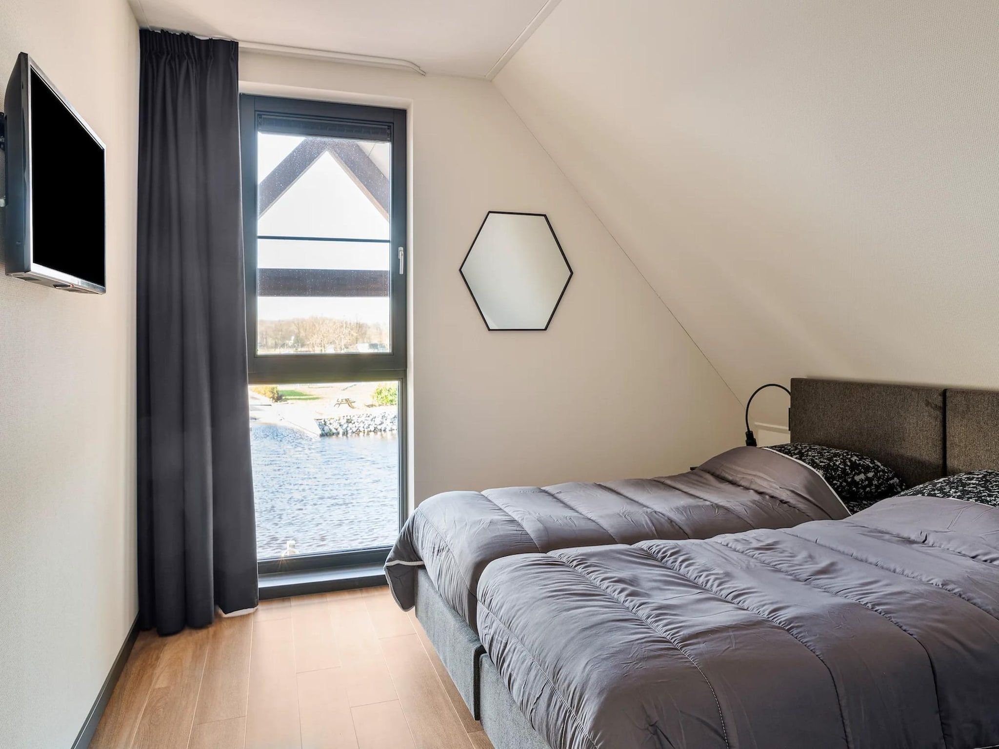 Een slaapkamer van Patrijs Wellness Plus 8 in Noardburgum