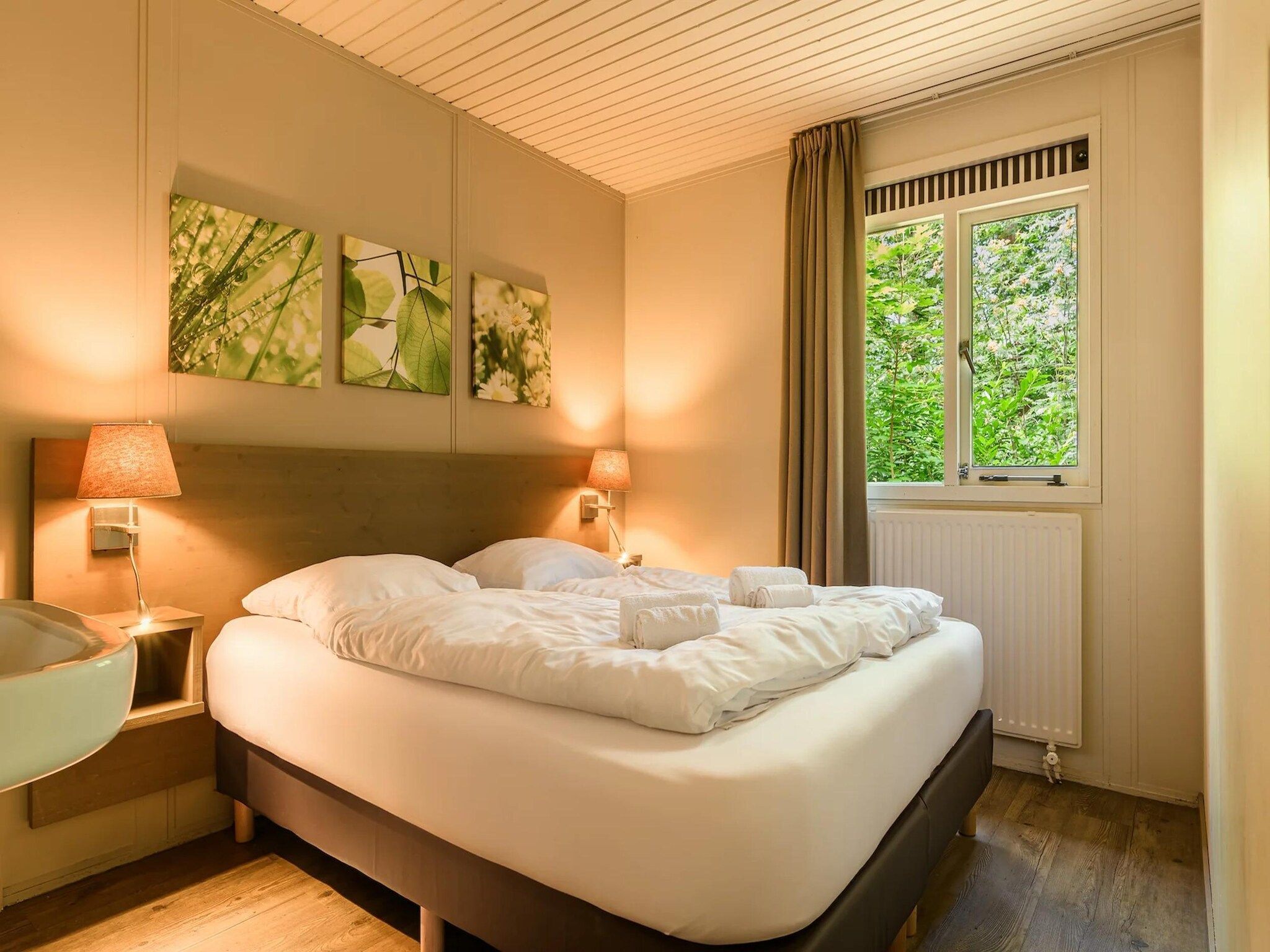 Een slaapkamer van Bungalow 4C3 in Putten