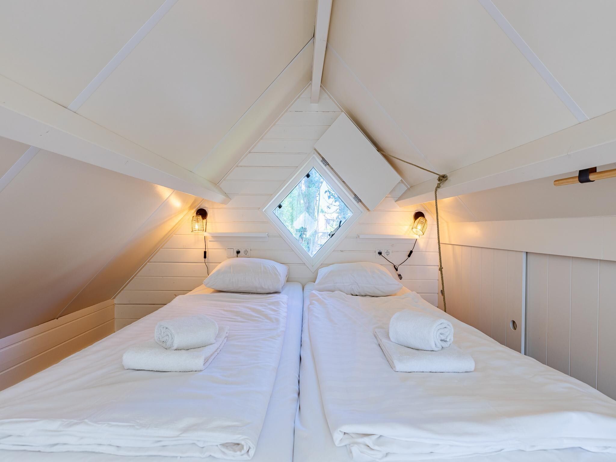 Een slaapkamer van Lijsterhofstraat 13 - Knusse vakantiewoning nabij strand en centrum in Domburg