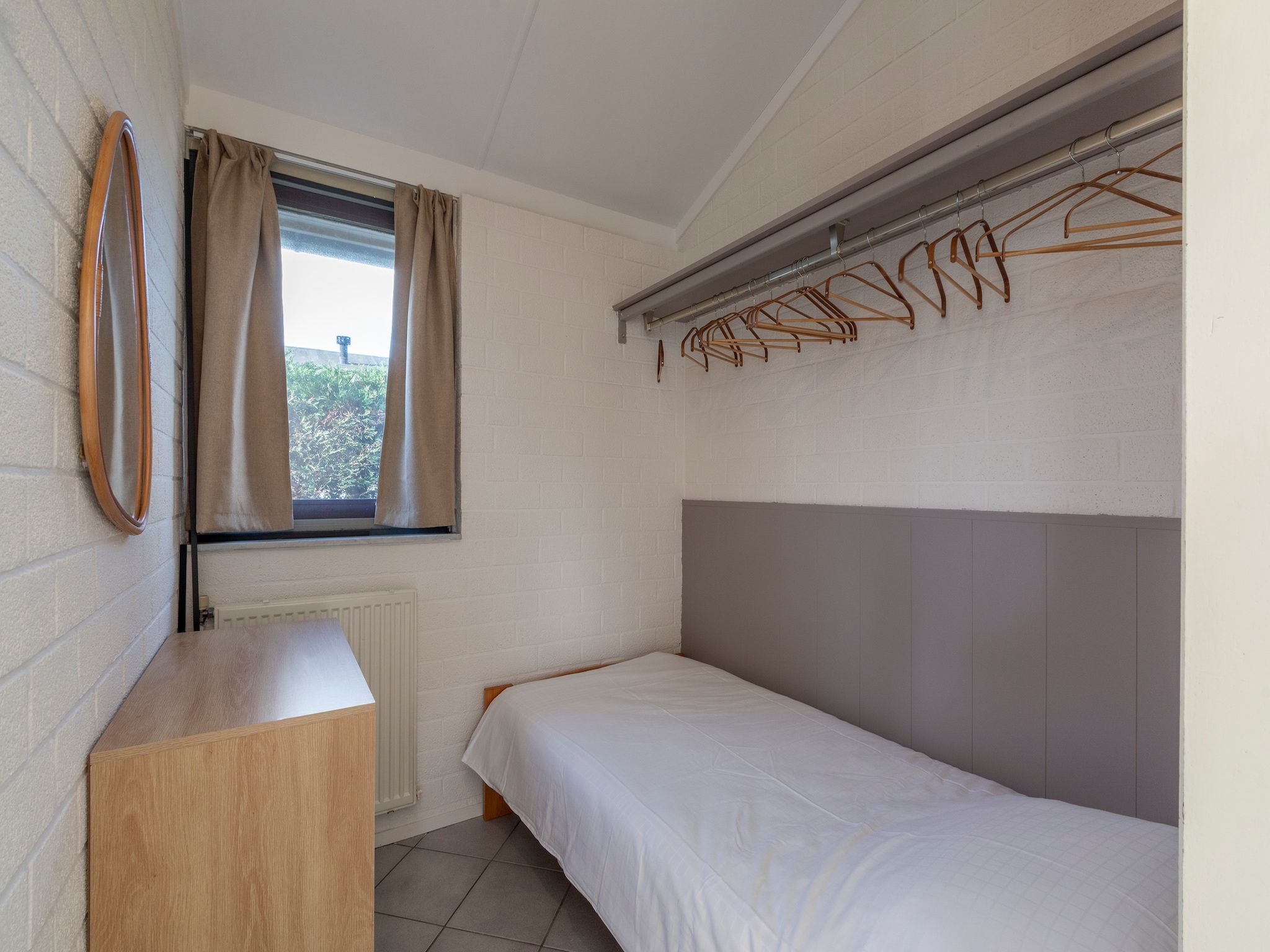 Een slaapkamer van Watersnip 57 "Huis Skuumkoppe" in Petten