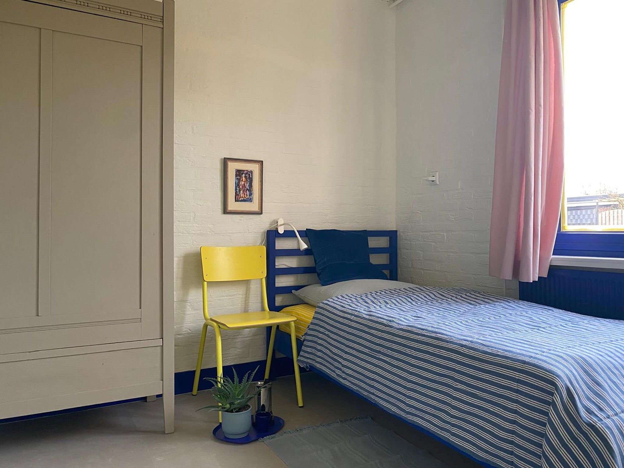 Een slaapkamer van Nana's in Noordwijkerhout