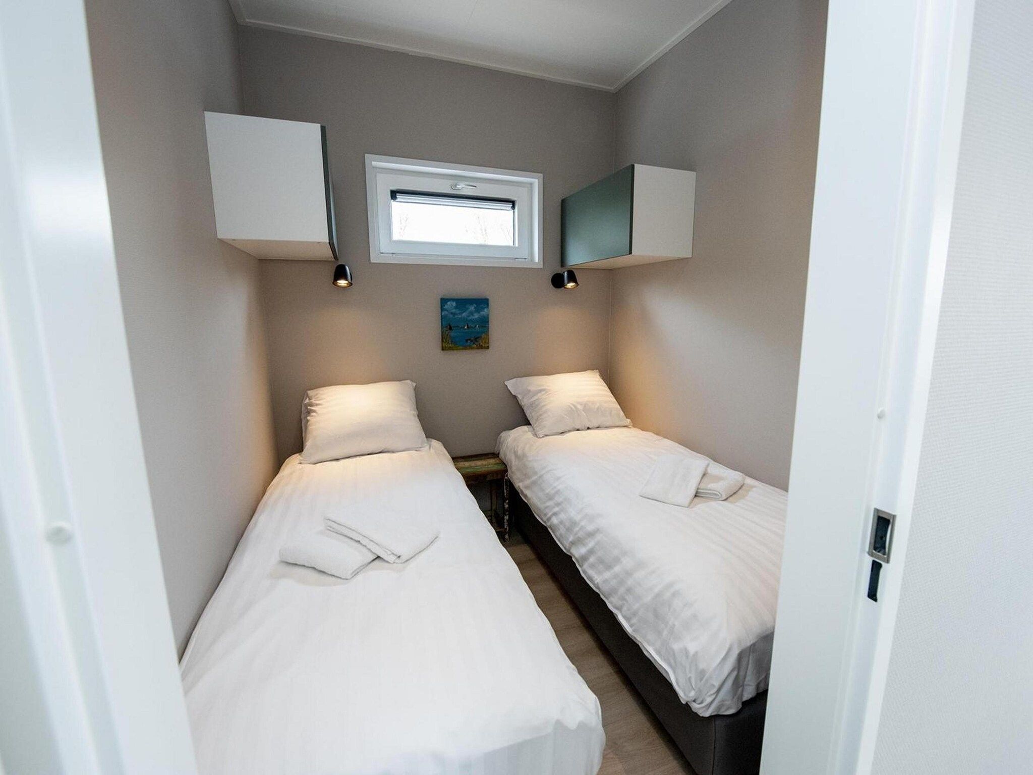 Een slaapkamer van RiggelBrug Sneekermeer in Offingawier