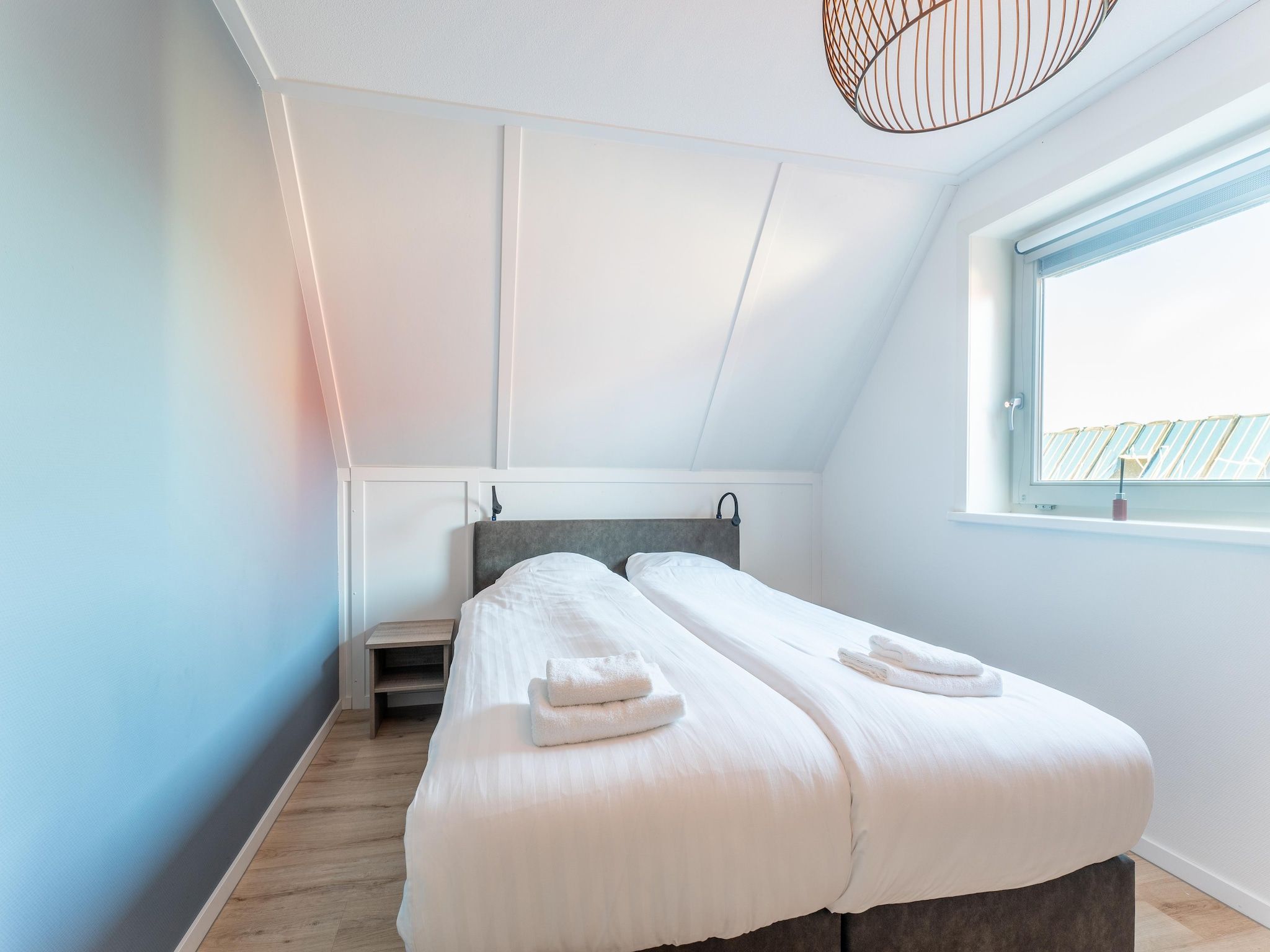 Een slaapkamer van Wulpdal 63 in Scherpenisse