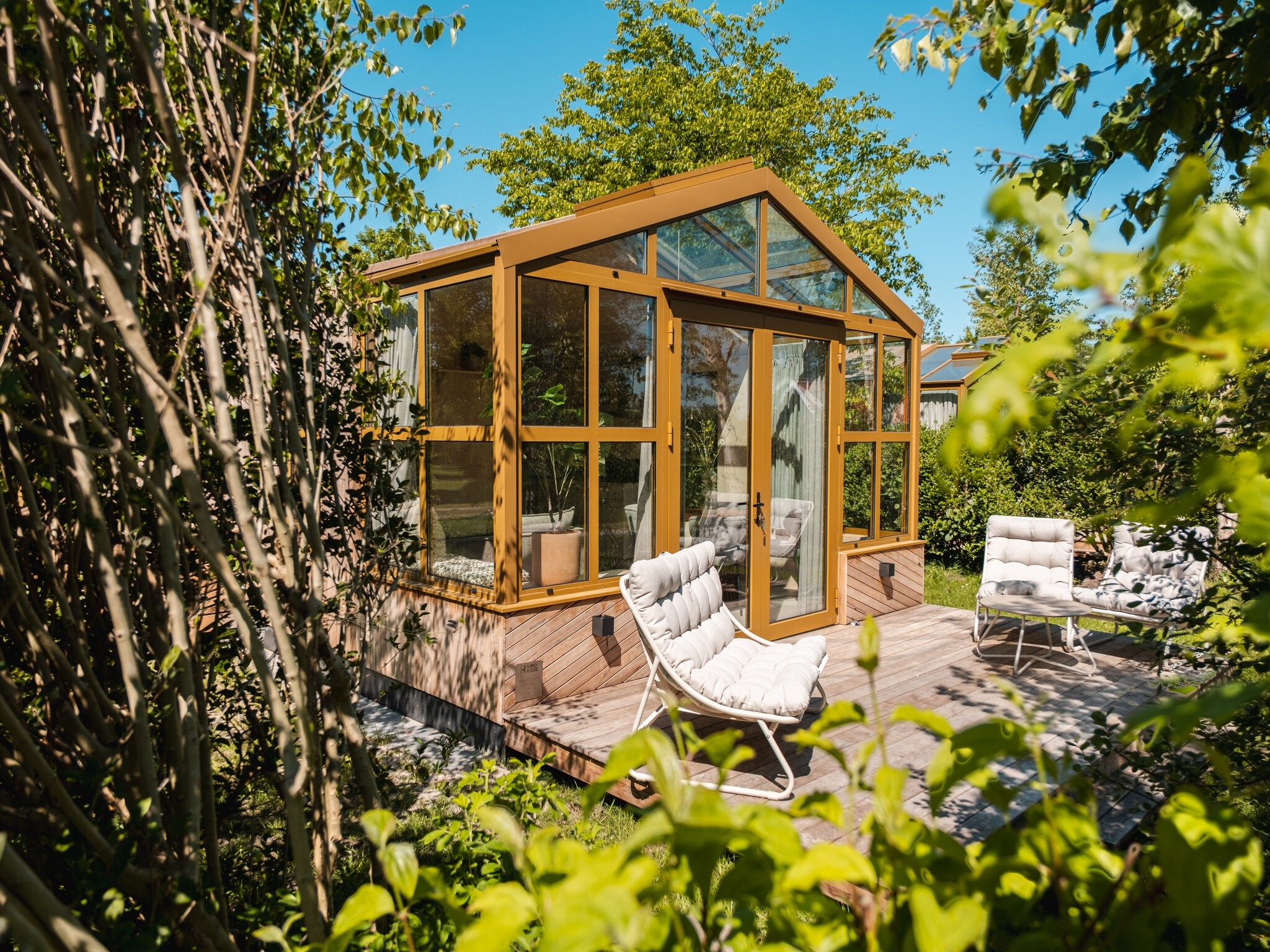 De tuin van Large Green House 4 persoons in Scherpenzeel (FR)