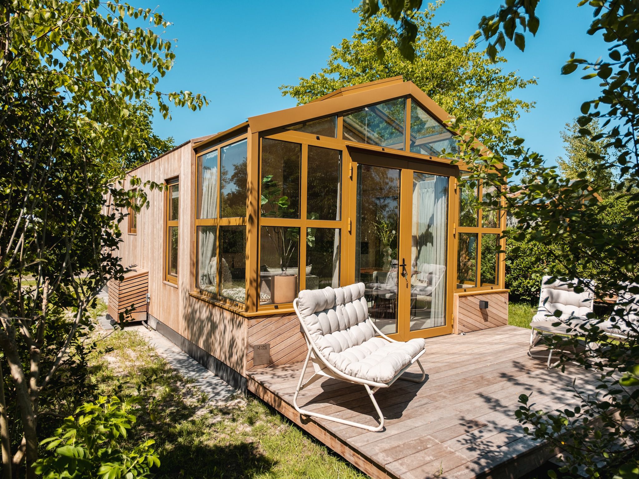 De tuin van Large Green House 4 persoons in Scherpenzeel (FR)