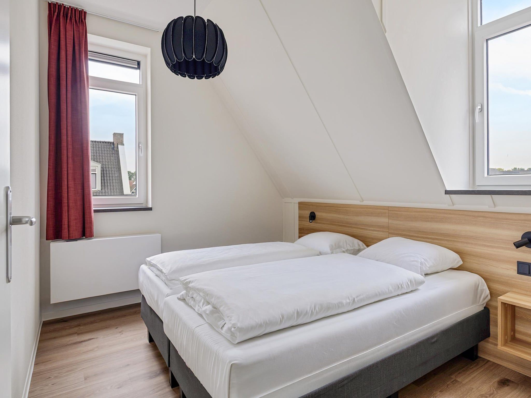Een slaapkamer van Dijkhuys Binnen in PS Opperdoes
