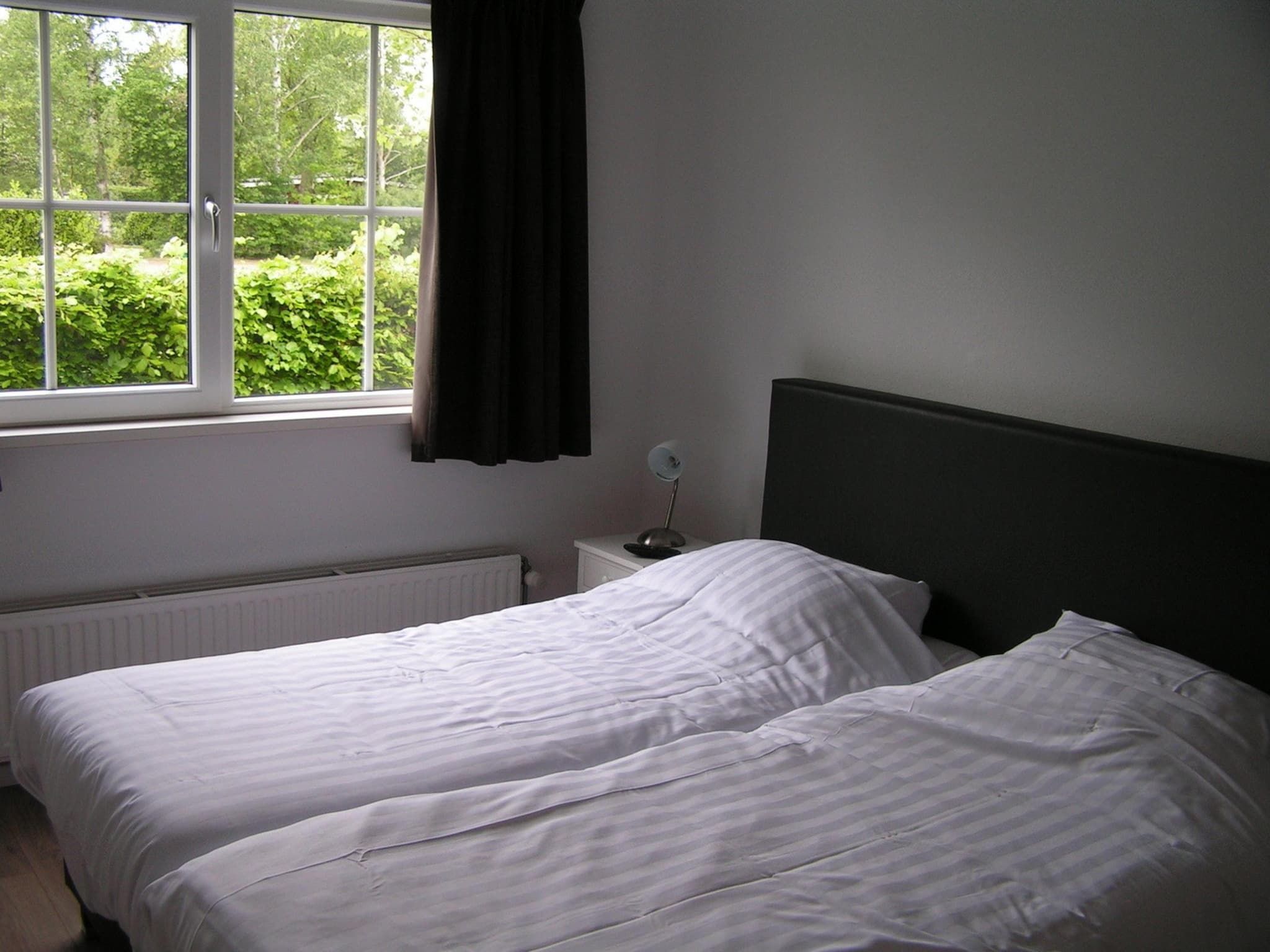 Een slaapkamer van Villa de Hertog 722 in Baarle-nassau