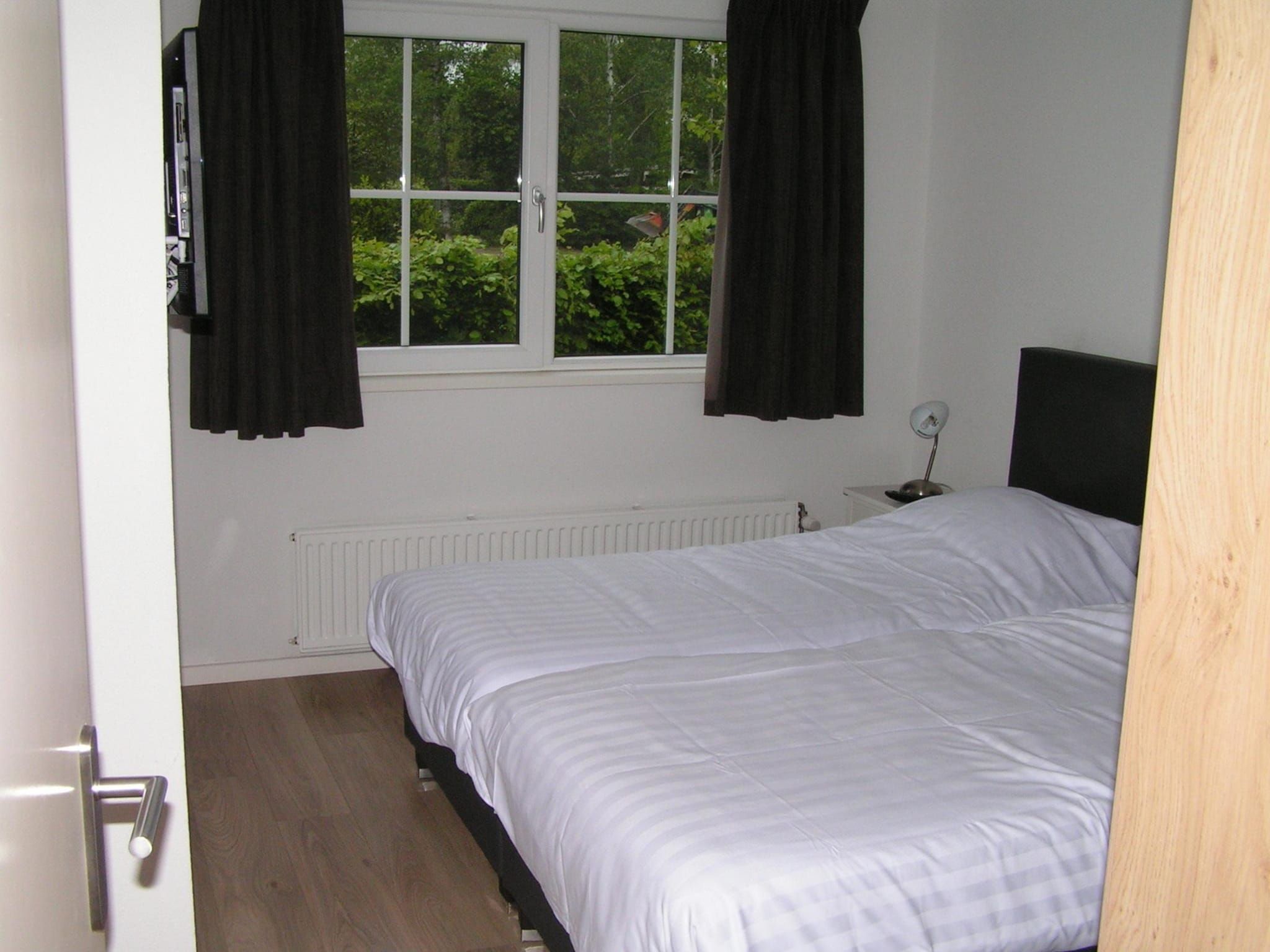 Een slaapkamer van Villa de Hertog 722 in Baarle-nassau