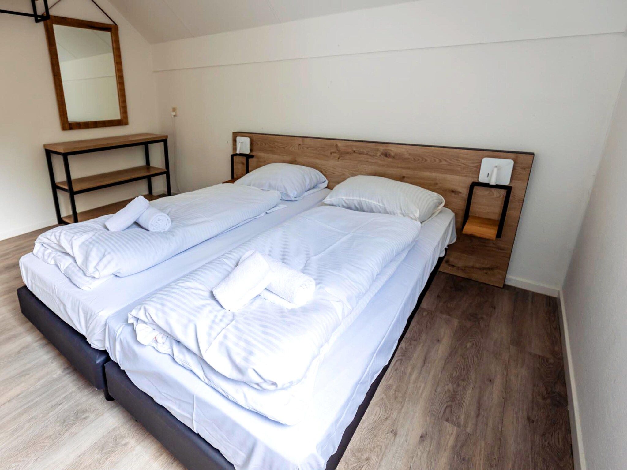 Een slaapkamer van 8 - Persons Family bungalow in Ewijk