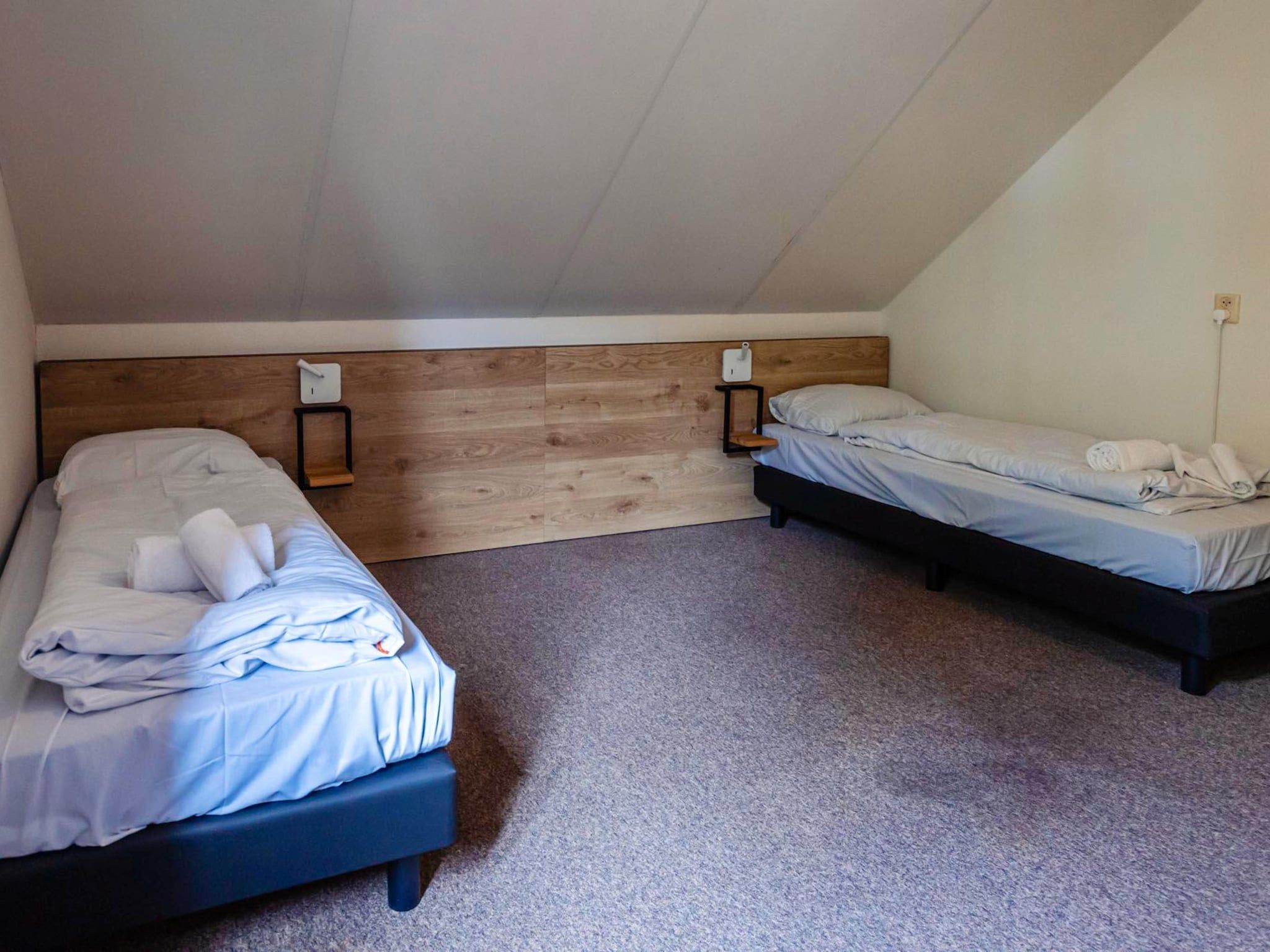 Een slaapkamer van 16 - Persons Family bungalow in Ewijk