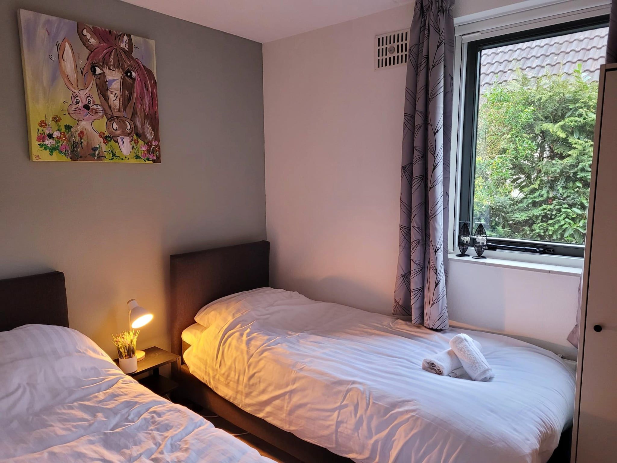 Een slaapkamer van 6 - Persons Forest Bungalow (copy) in Ewijk