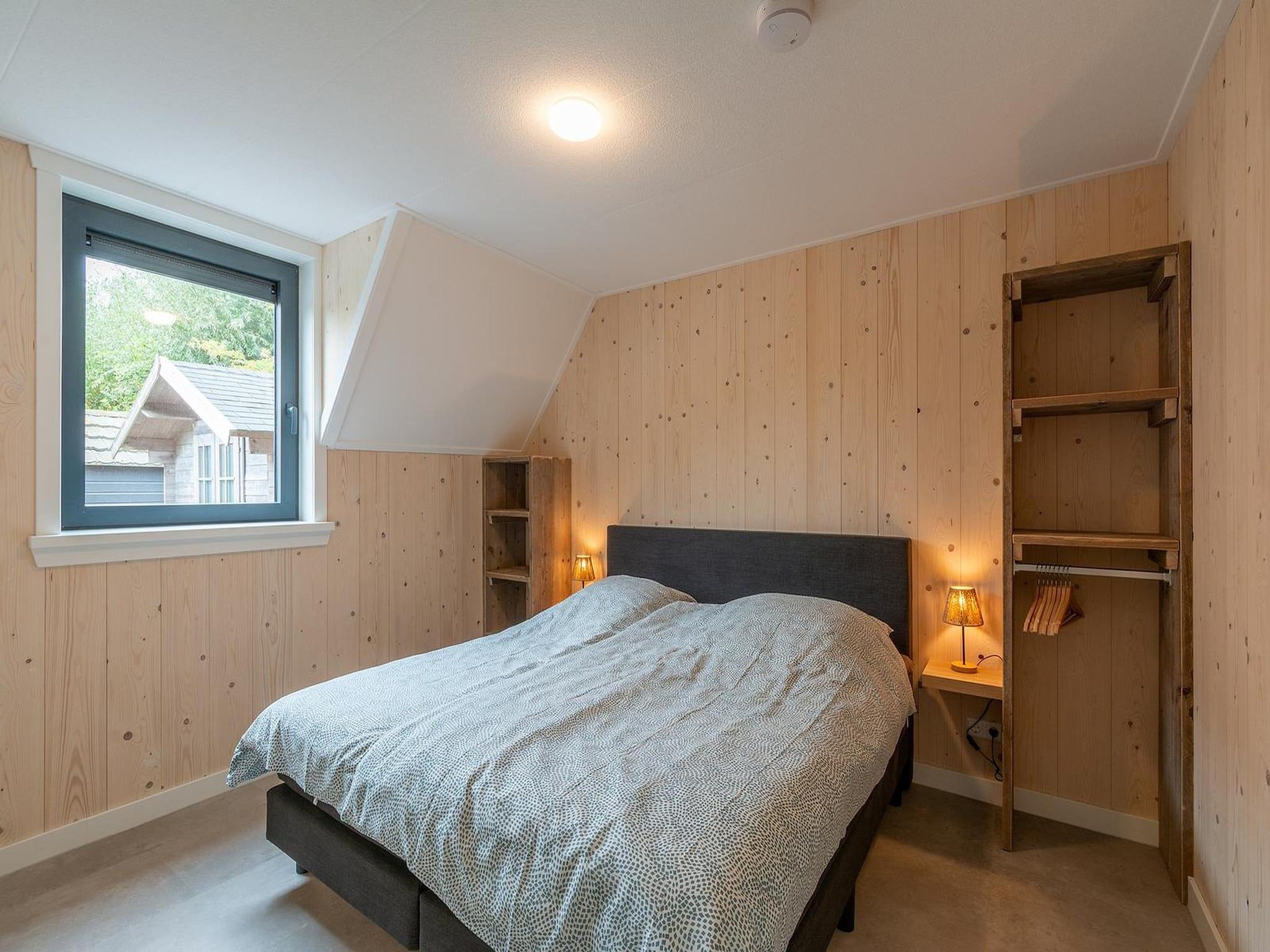Een slaapkamer van Sandepark 113 in Groote Keeten