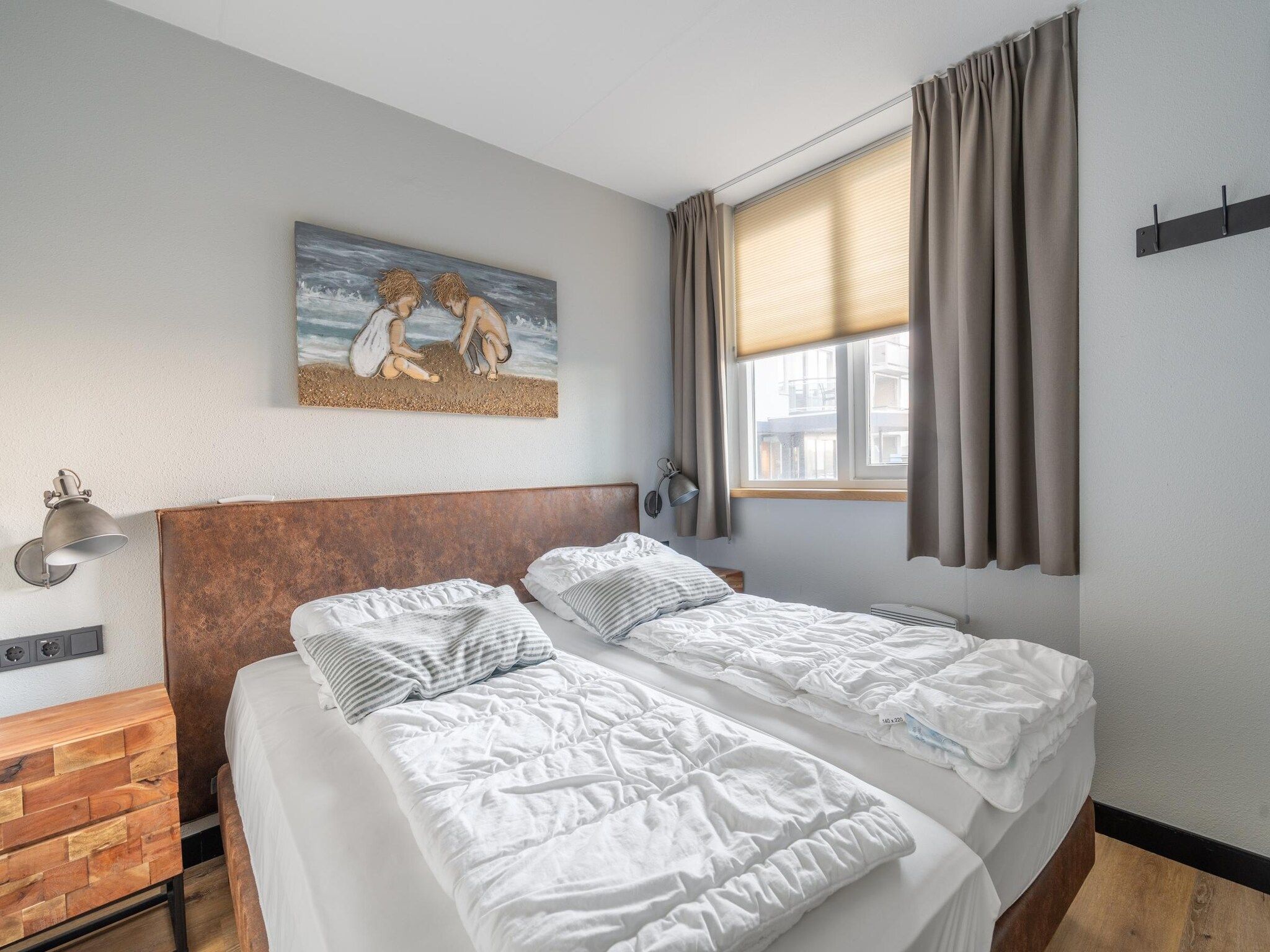 Een slaapkamer van Juliana 044 in De Koog