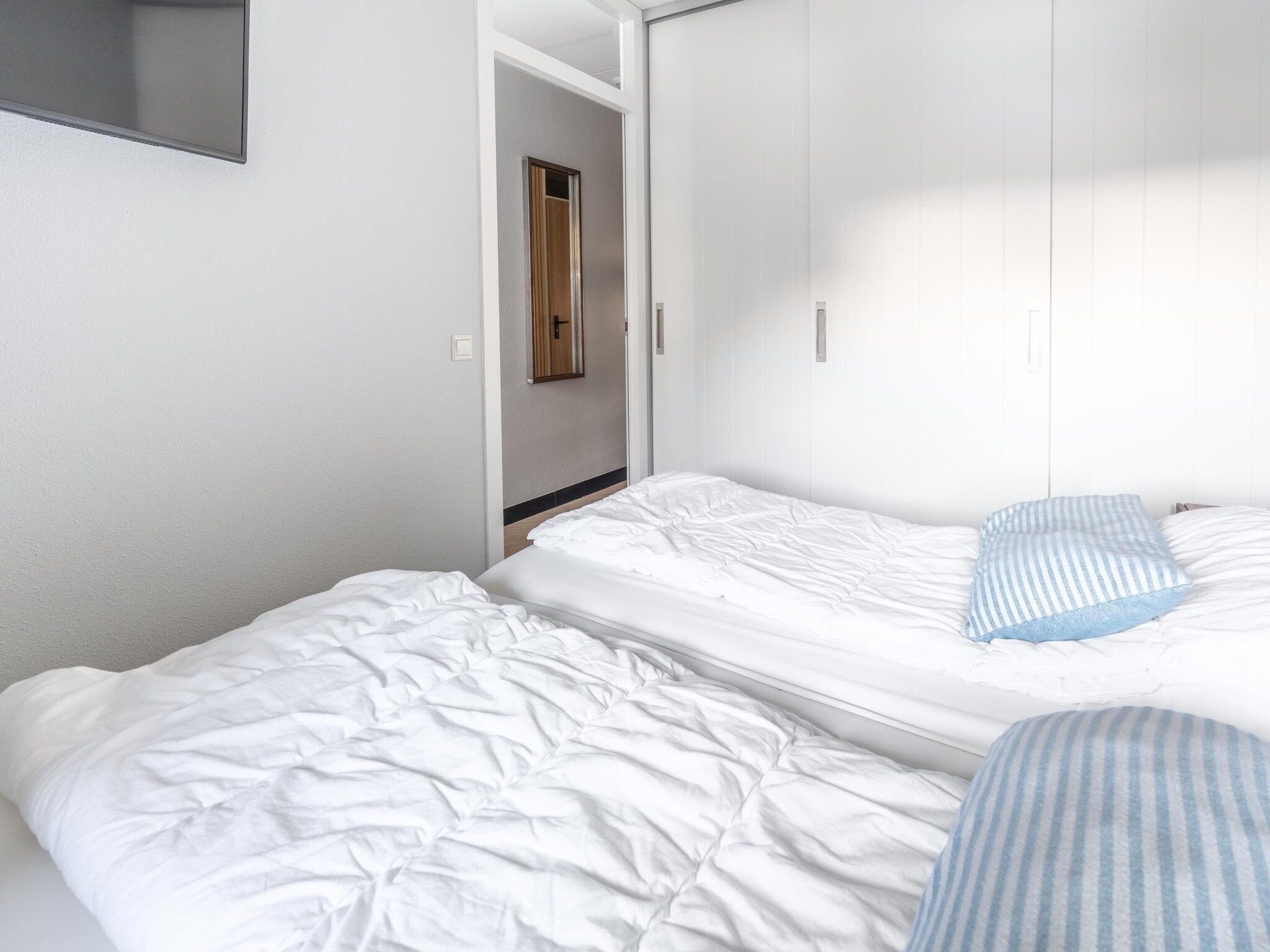 Een slaapkamer van Juliana 044 in De Koog