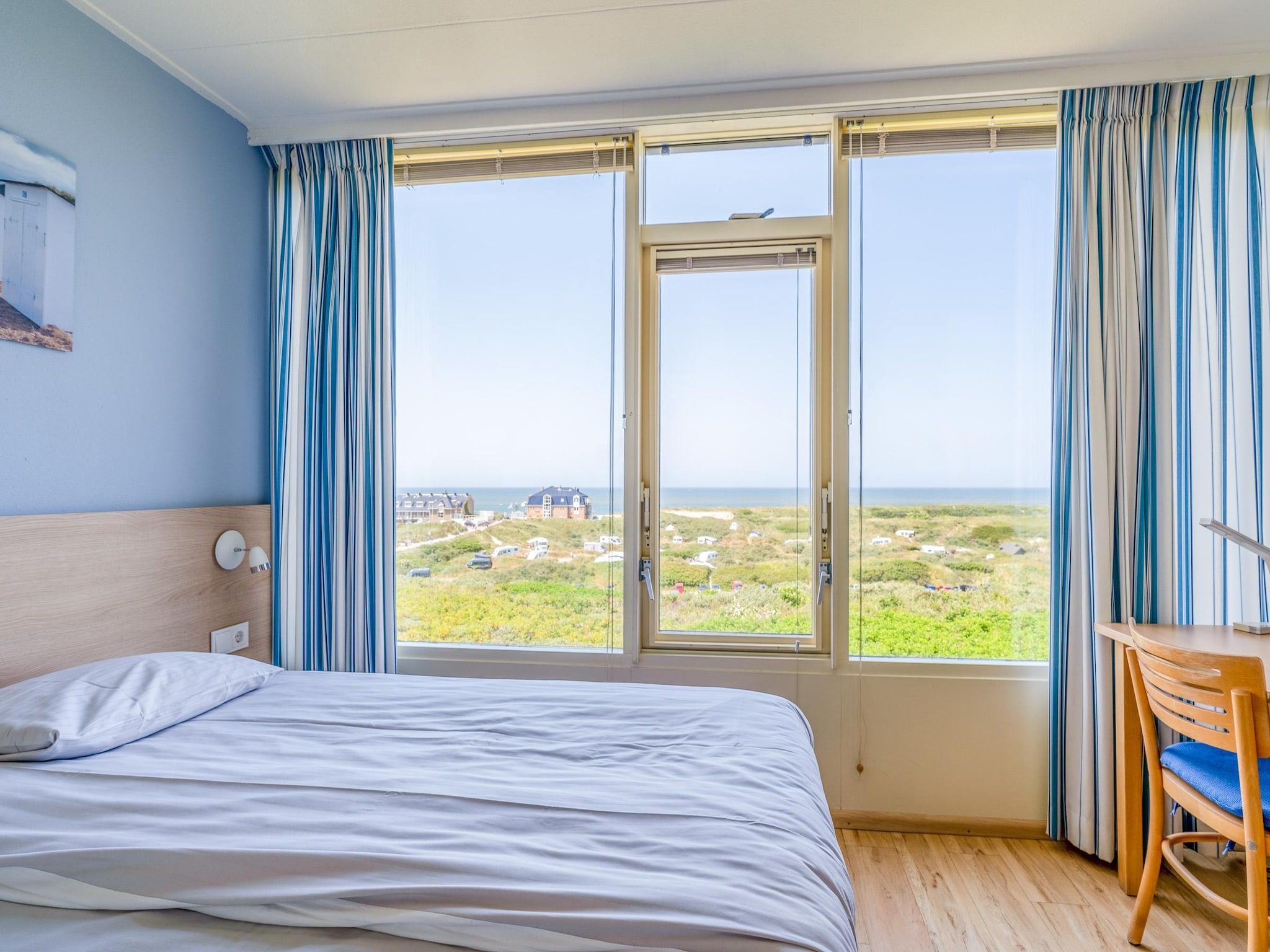 Een slaapkamer van Juliana 110 in De Koog