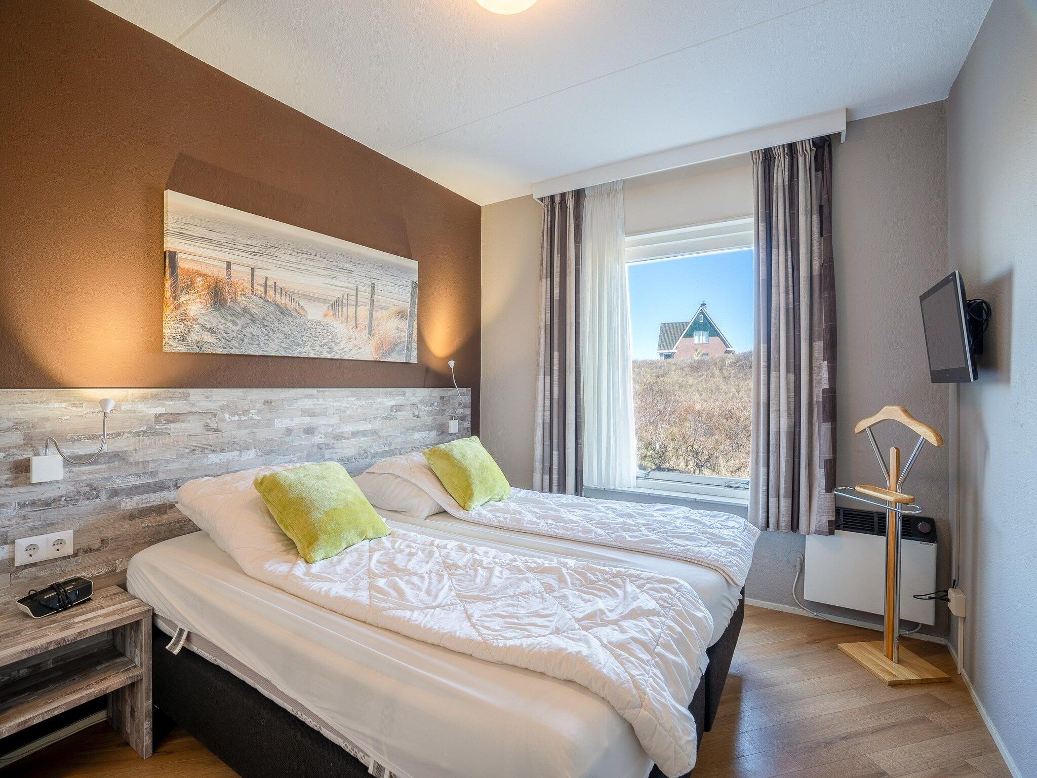 Een slaapkamer van Juliana 070 in De Koog