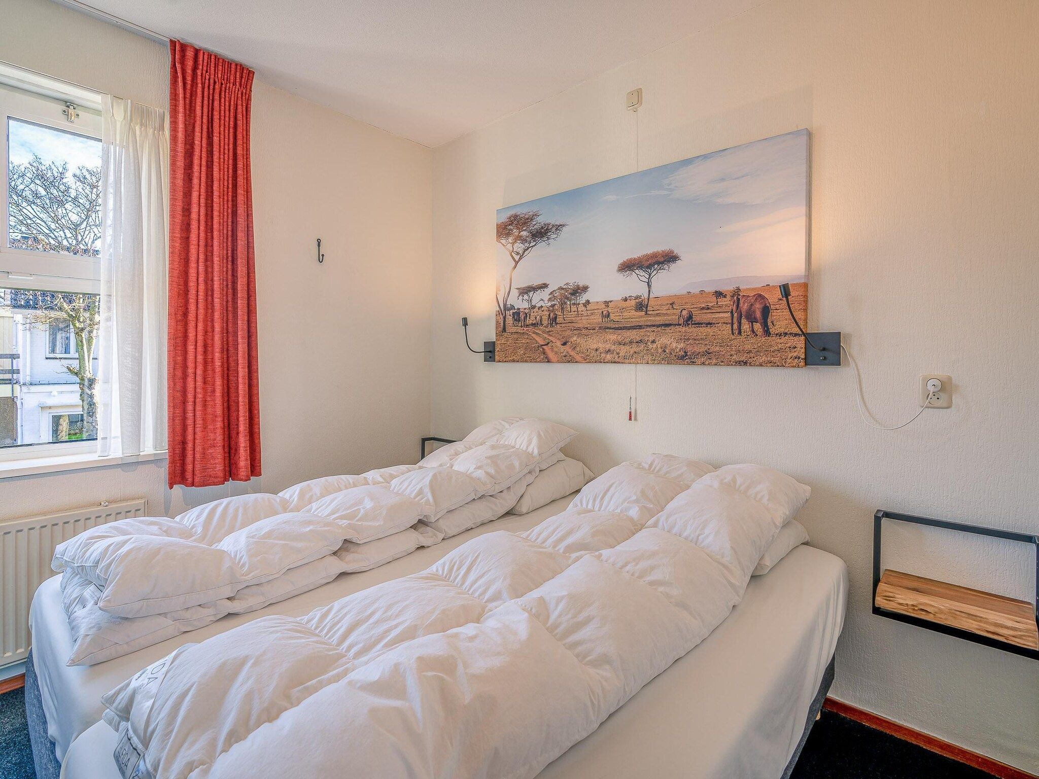 Een slaapkamer van Zeedistel 20 in De Koog