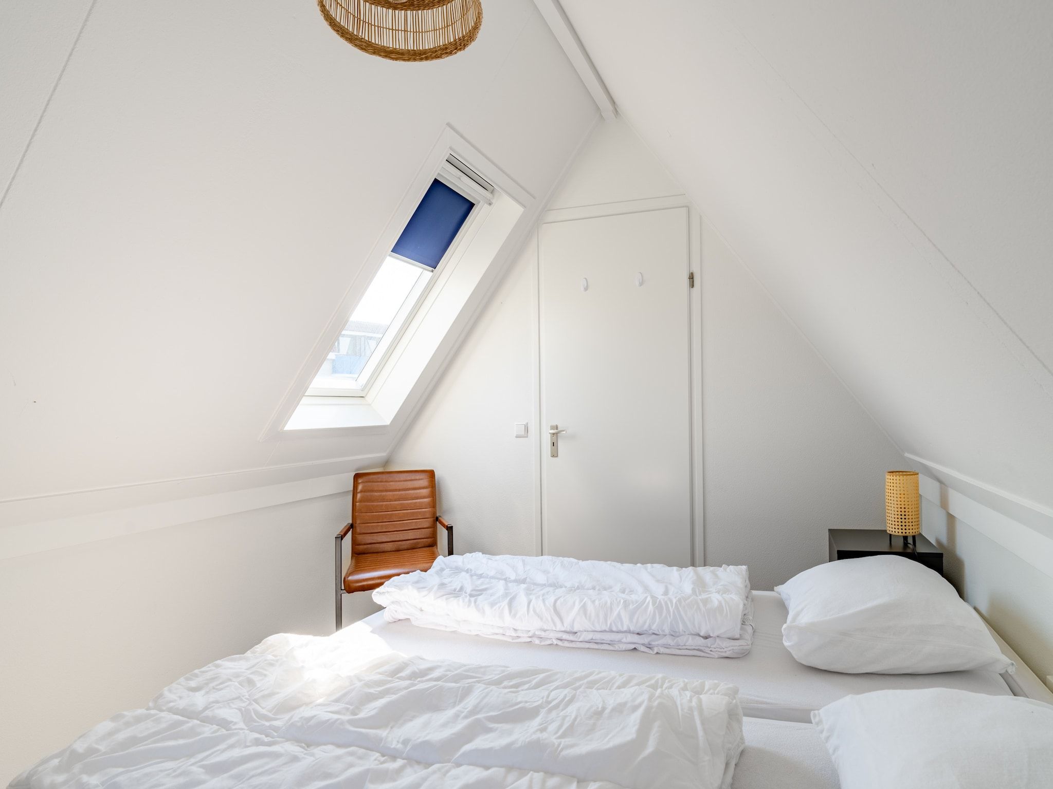 Een slaapkamer van Plevierstraat 3A in De Koog