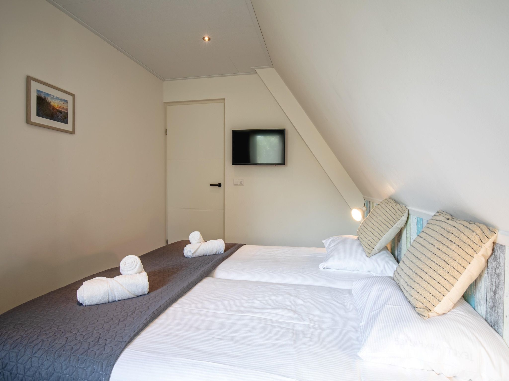 Een slaapkamer van De Witte Parel in Den Burg