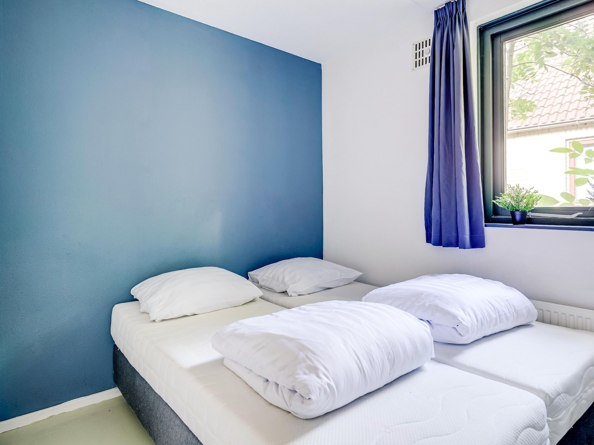 Een slaapkamer van 6 - Persons De Zingende Wilg (copy) (copy) (copy) in Ewijk