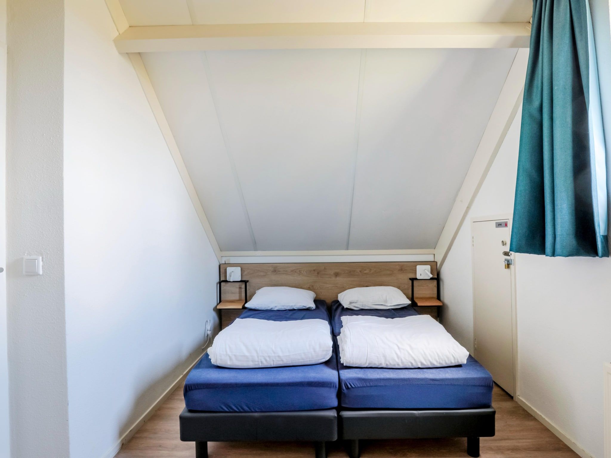 Een slaapkamer van 7 - Persoons Forest 217 Sauna Bungalow (copy) (copy) (copy) in Ewijk