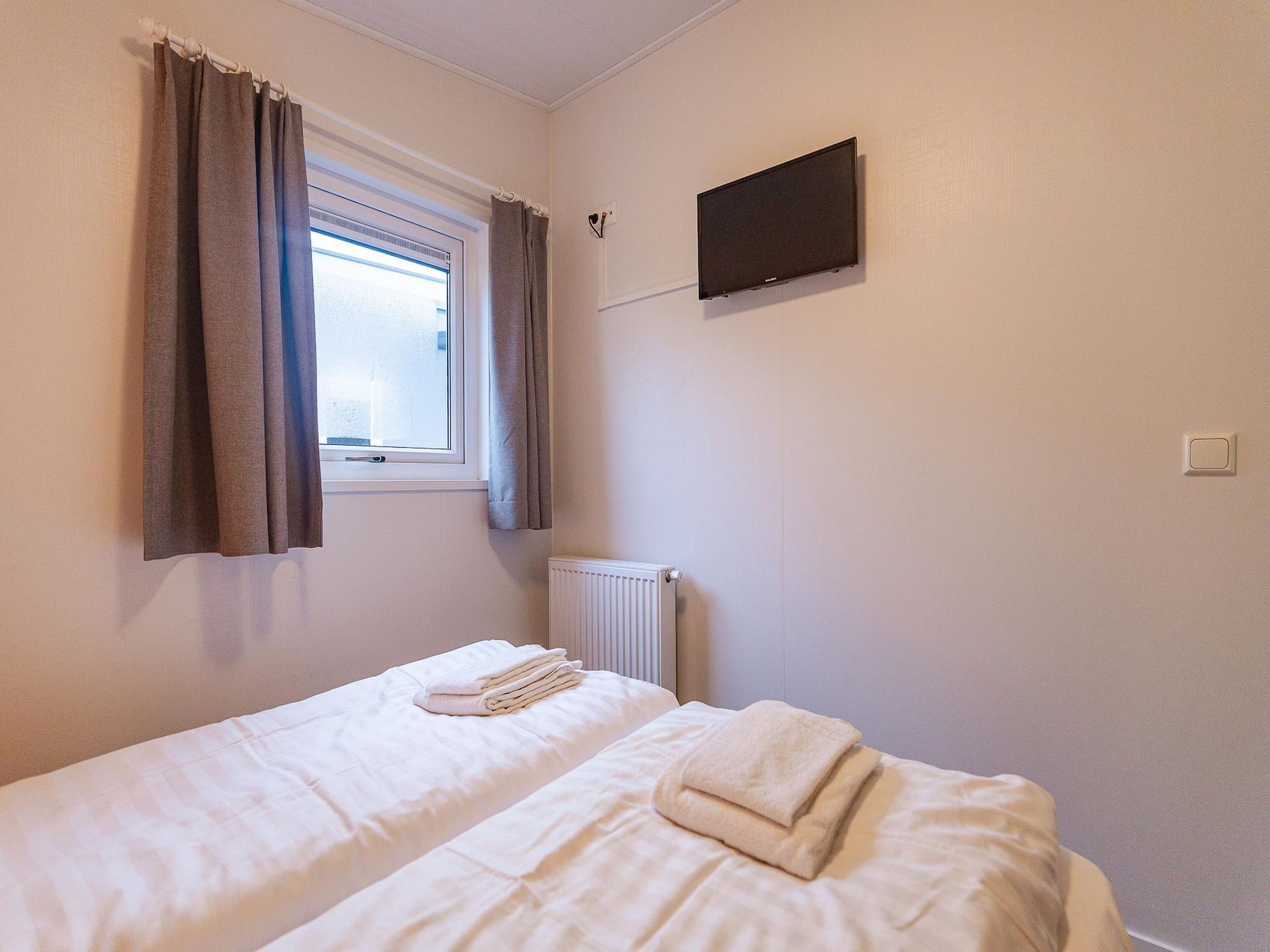 Een slaapkamer van Duinhoeve Chalet Zeeland (huisdier toegestaan) in Burgh-Haamstede