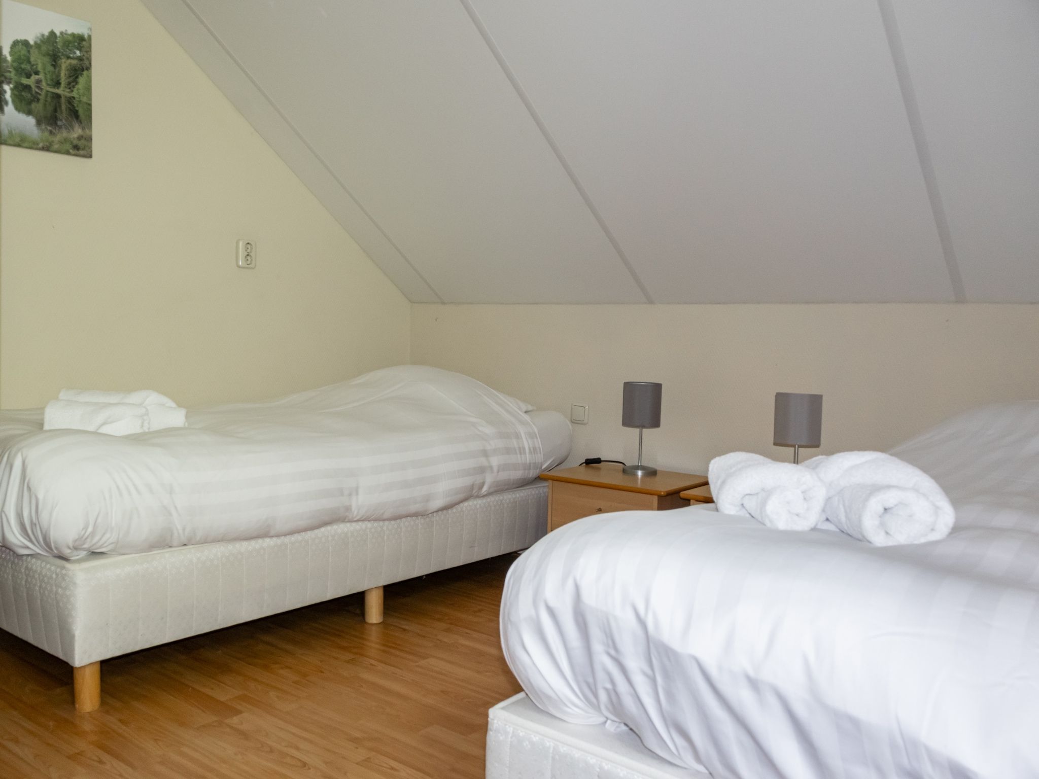 Een slaapkamer van Huis in de Bossen in Een