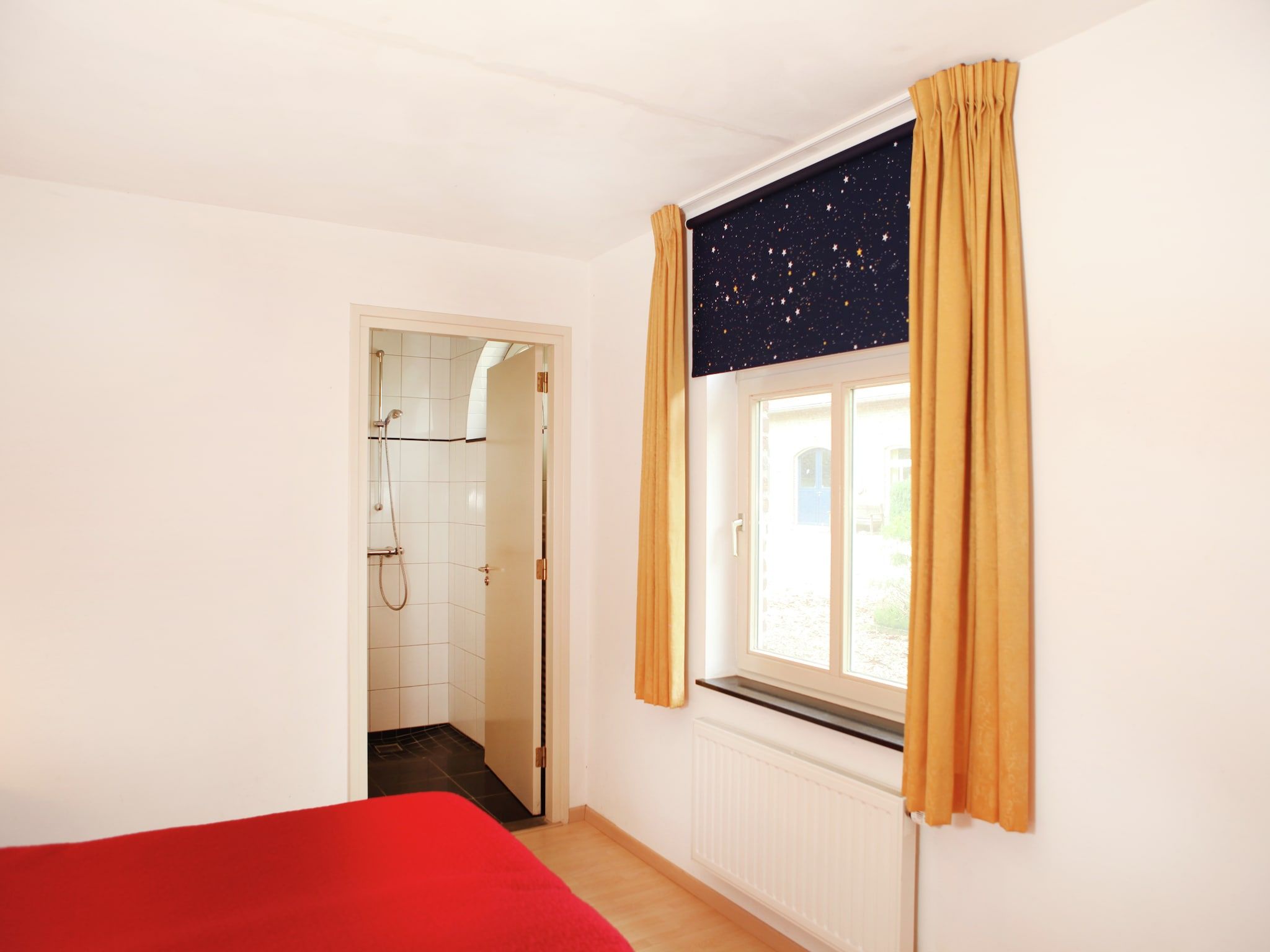 Een slaapkamer van Klein Paarlo in Sint Odilienberg