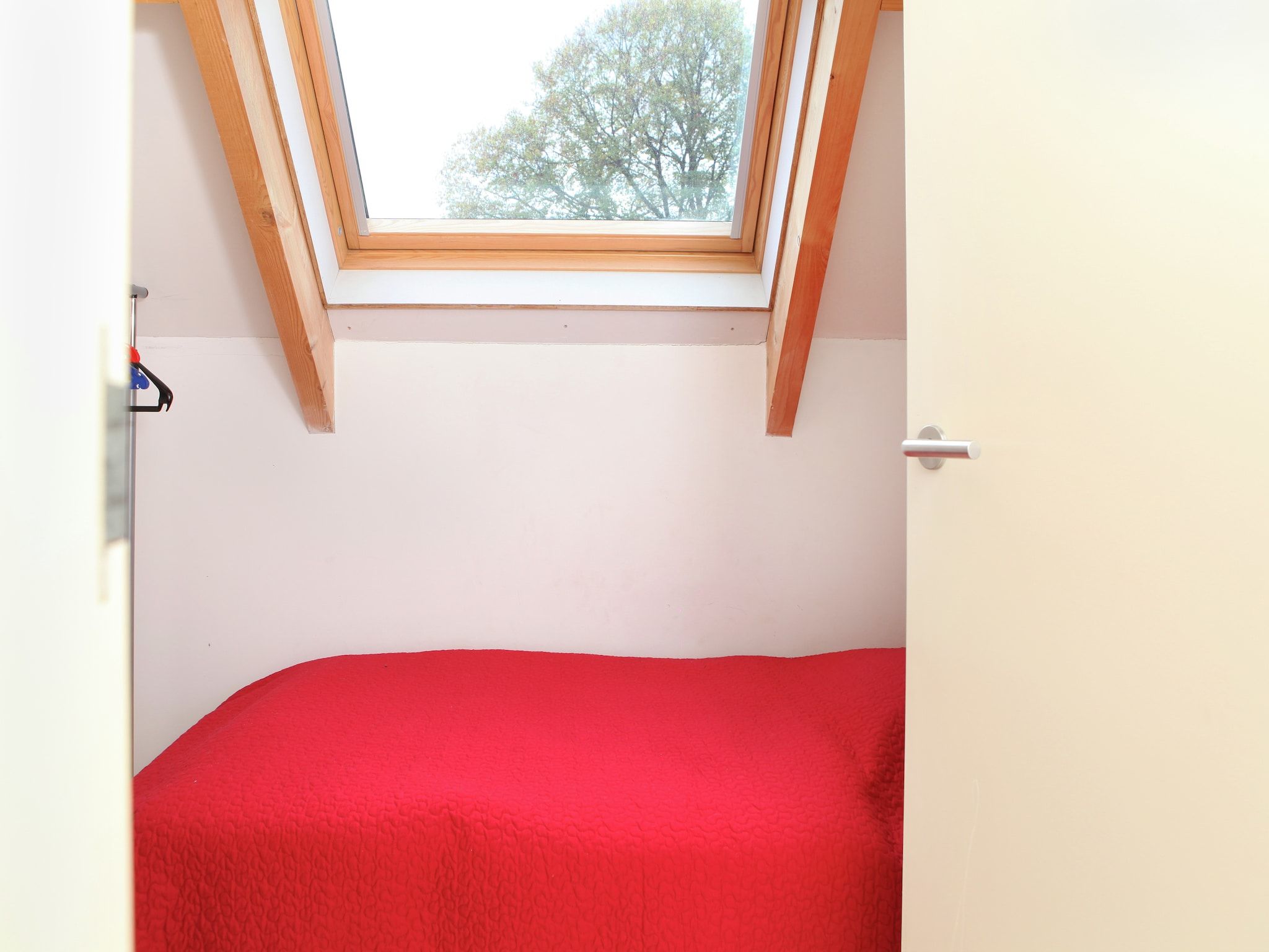 Een slaapkamer van Klein Paarlo in Sint Odilienberg