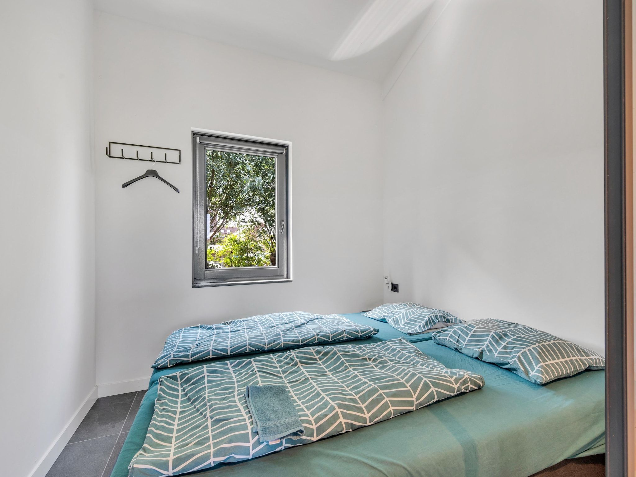 Een slaapkamer van De Waterlelie in Hekendorp