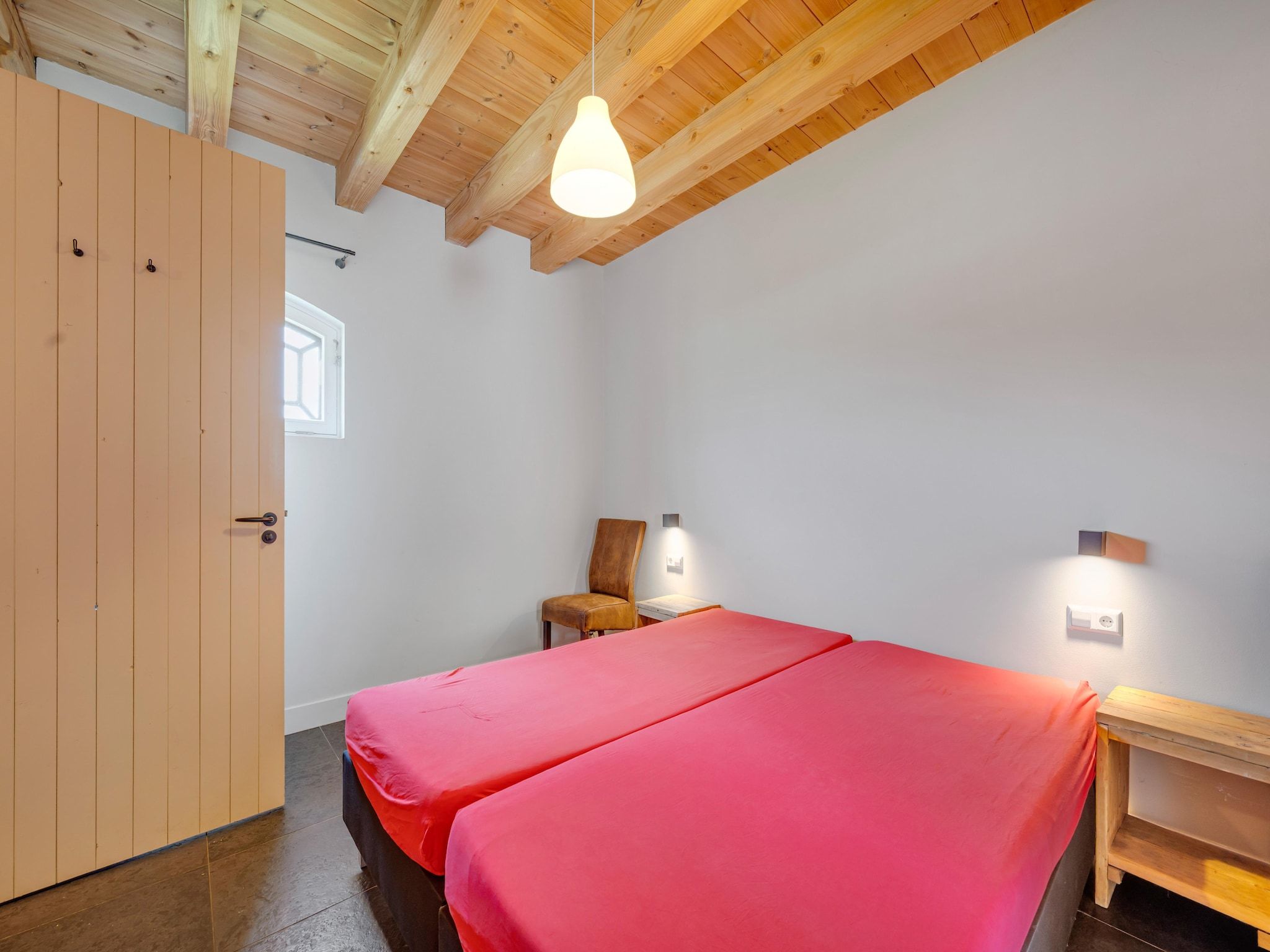 Een slaapkamer van De Kleine Stal in Snelrewaard