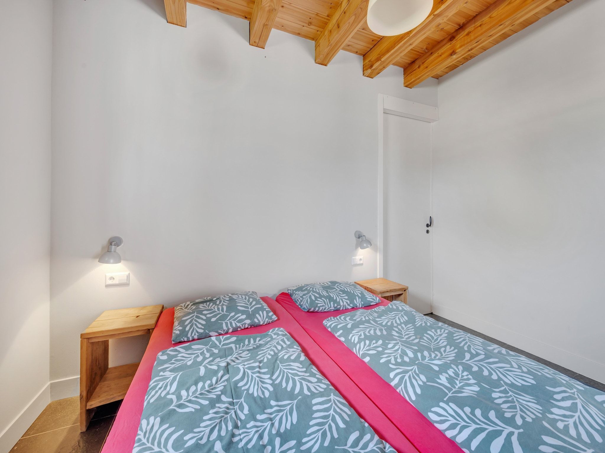 Een slaapkamer van De Kleine Stal in Snelrewaard