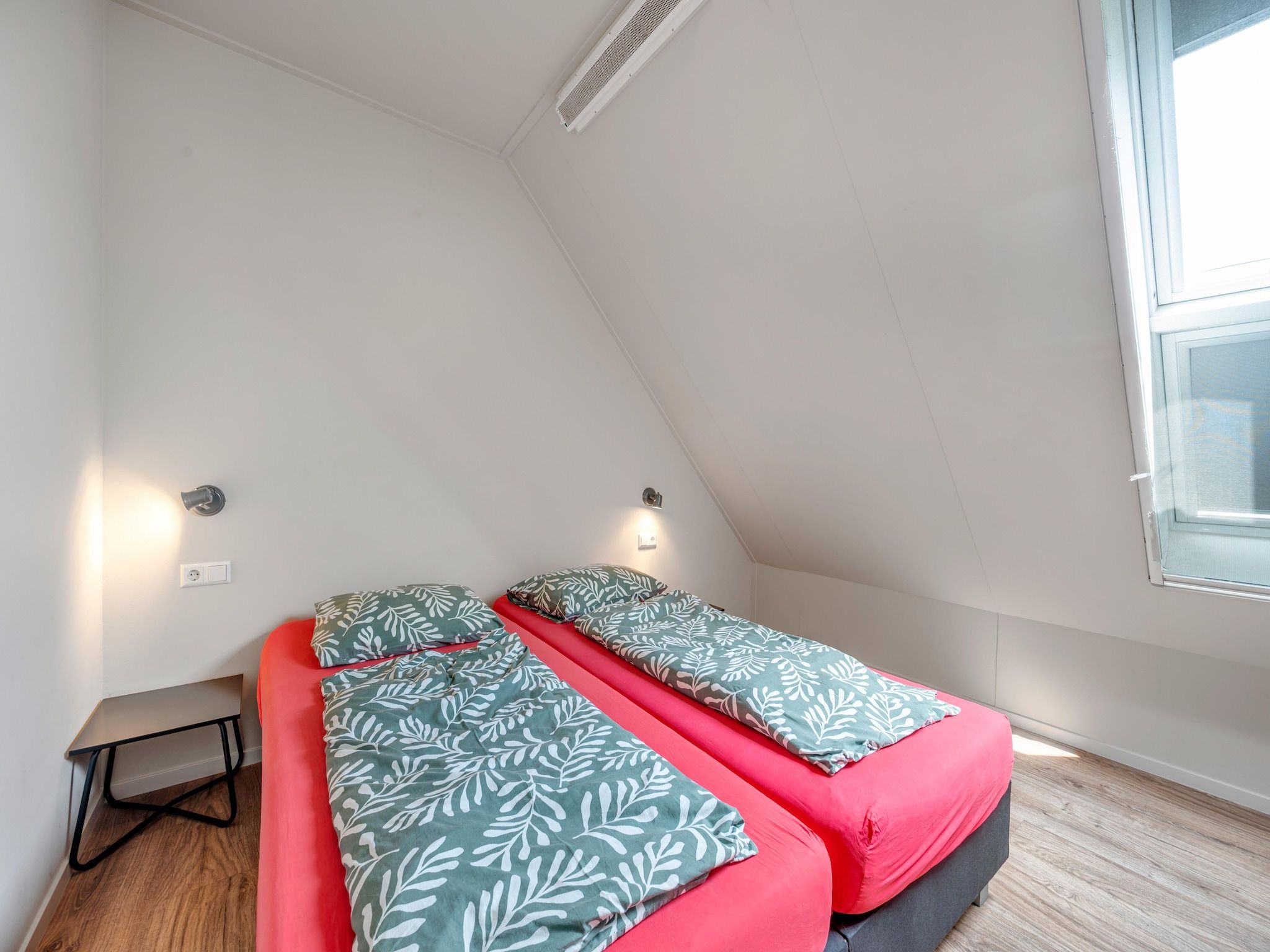 Een slaapkamer van De Kleine Stal in Snelrewaard