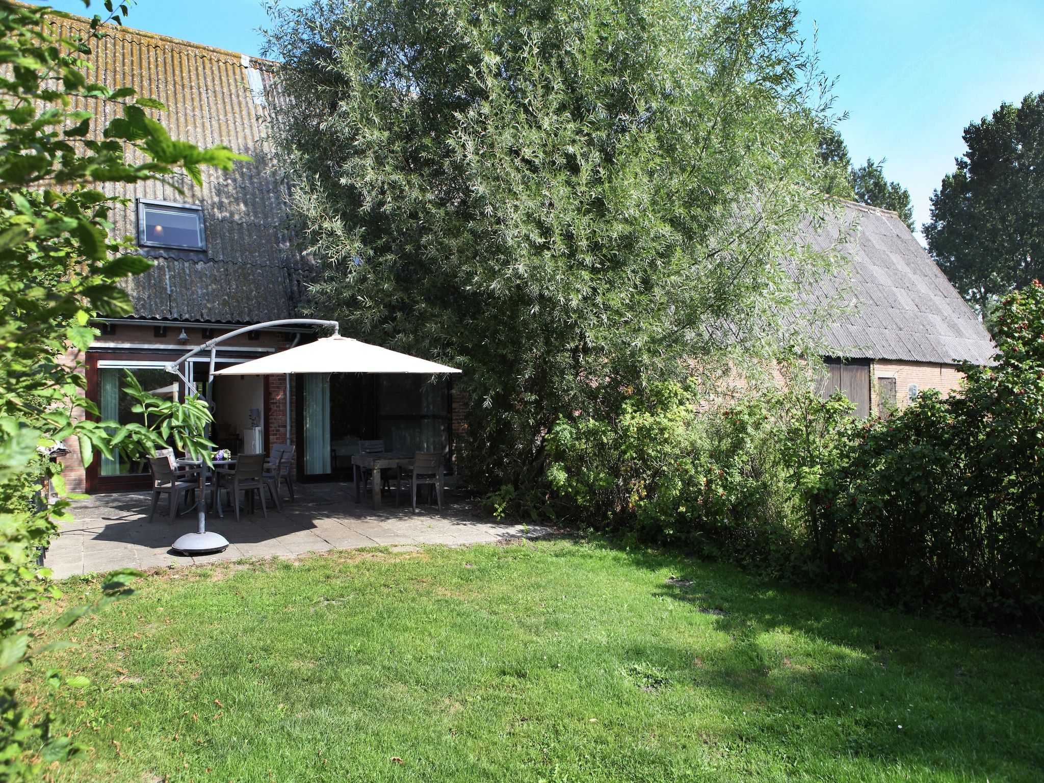 De tuin van Appartement De Dorsvloer in Eede