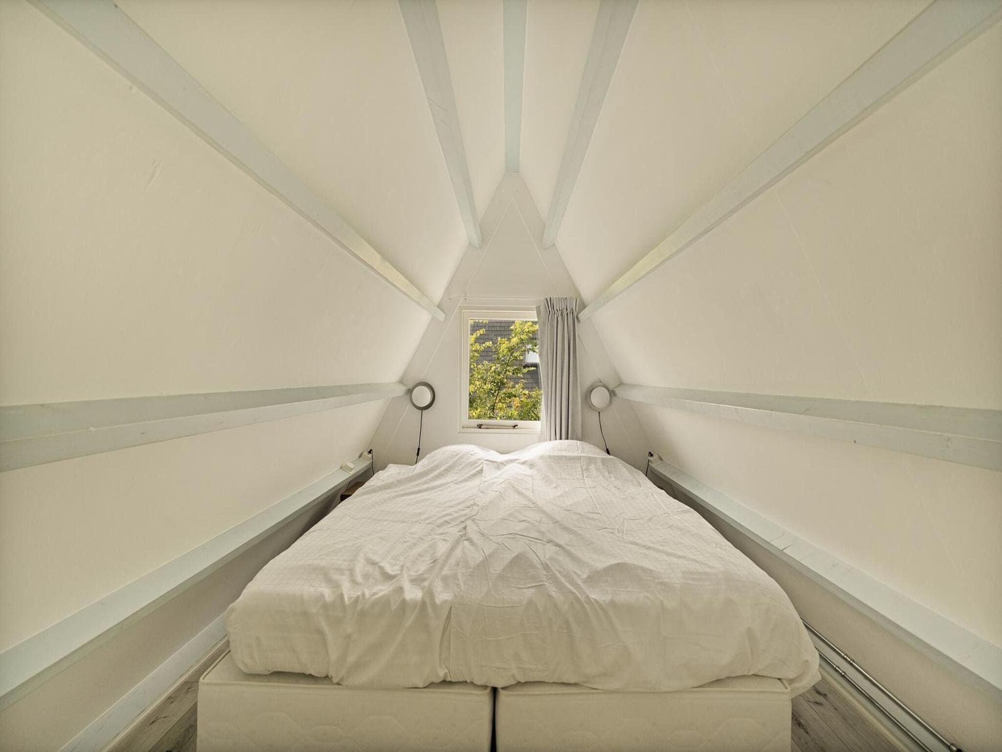 Een slaapkamer van Sandepark 37 in Groote Keeten