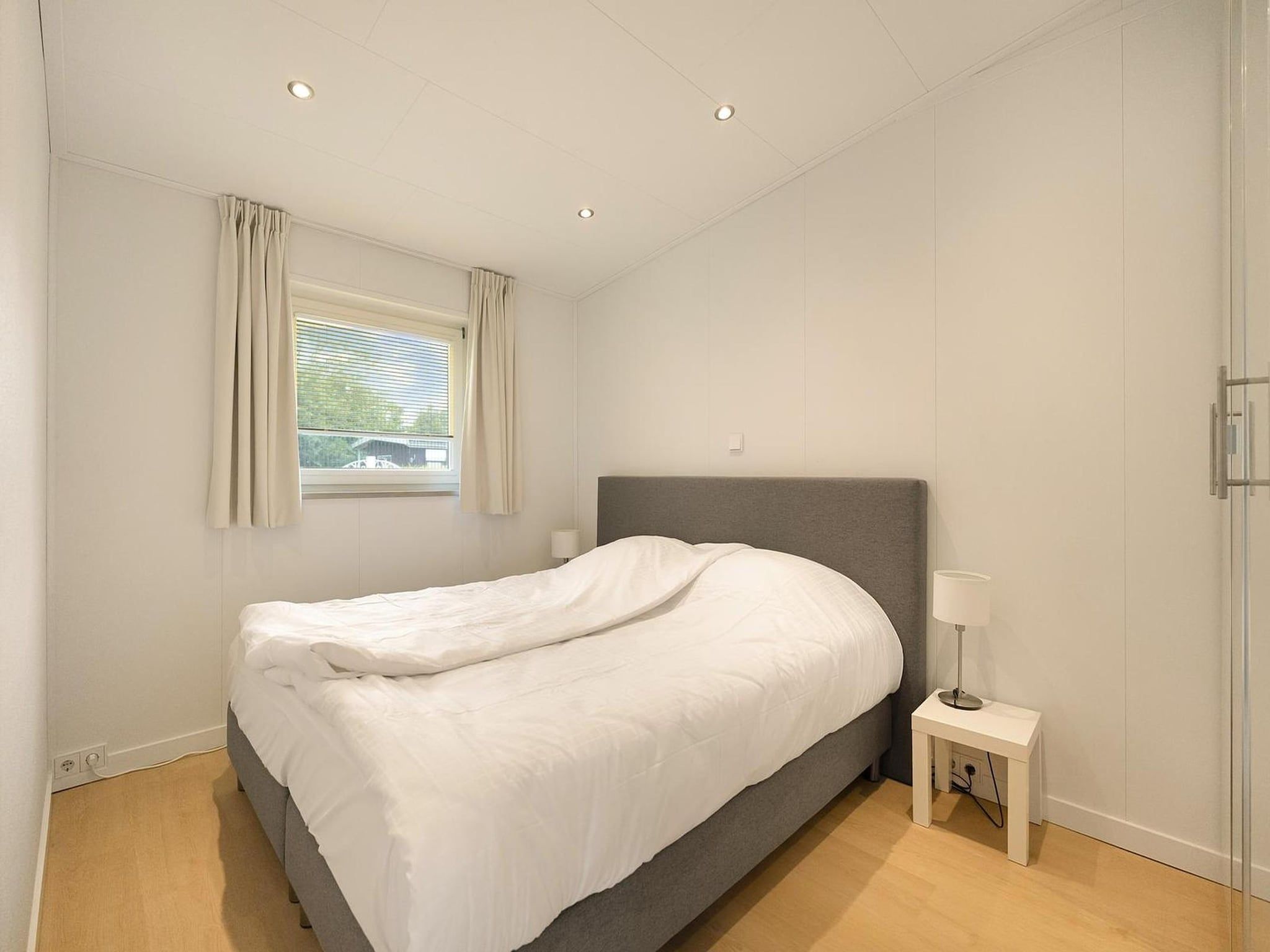 Een slaapkamer van Eureka 57 in Sint Maartensvlotbrug