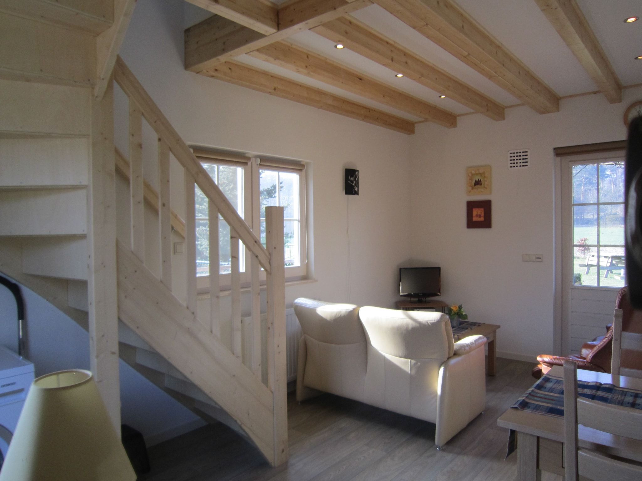 De woonkamer van Le Petit Miracle in Well