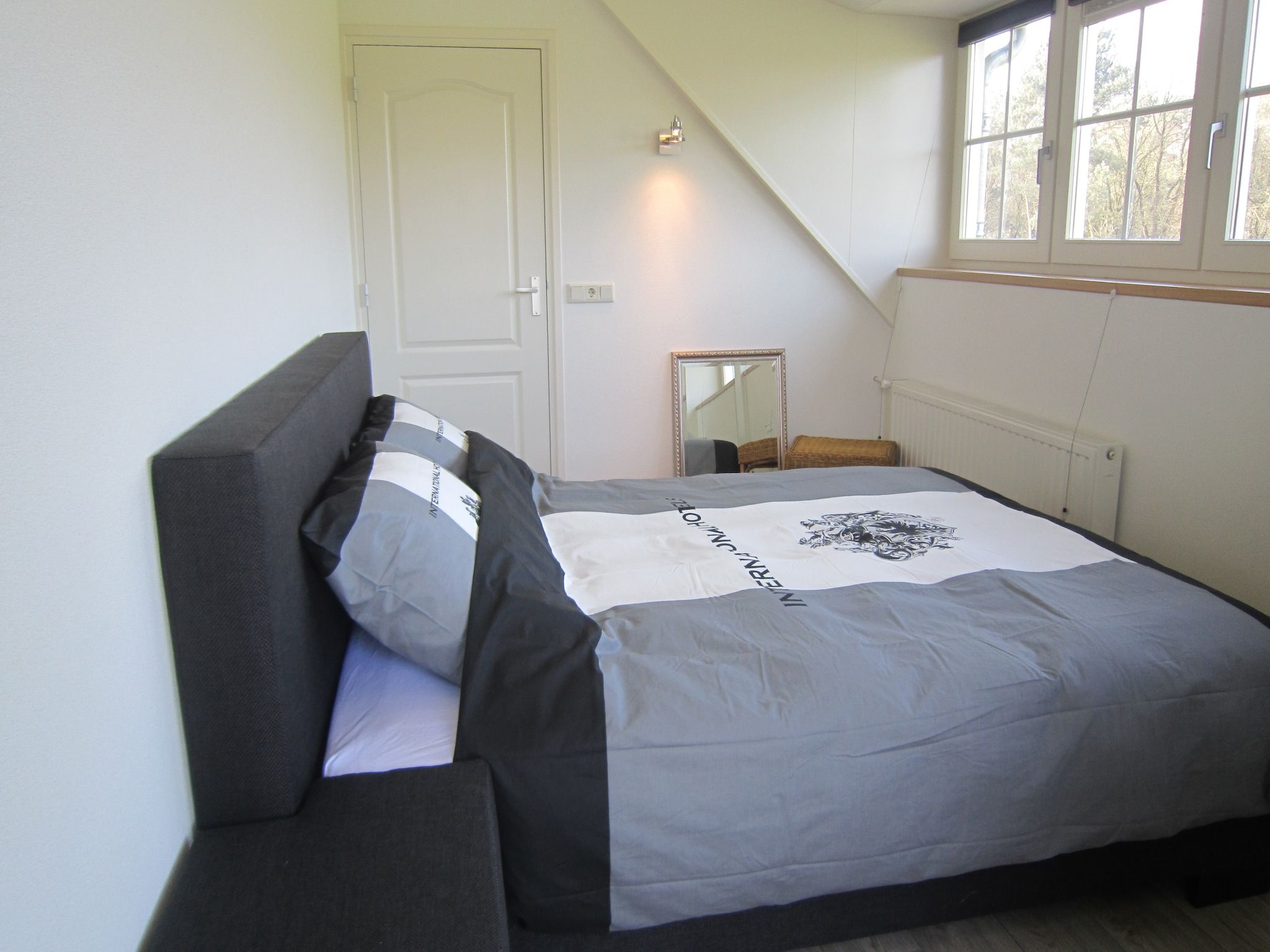 Een slaapkamer van Le Petit Miracle in Well