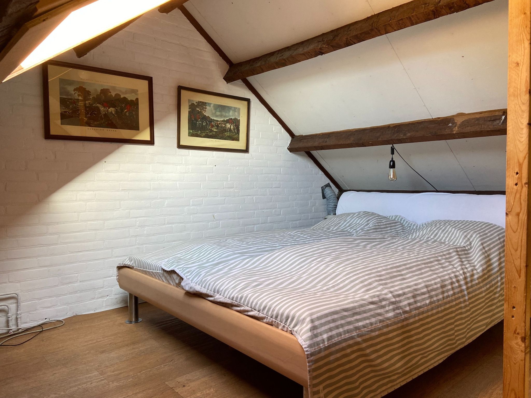 Een slaapkamer van Huis in het bos in Oploo