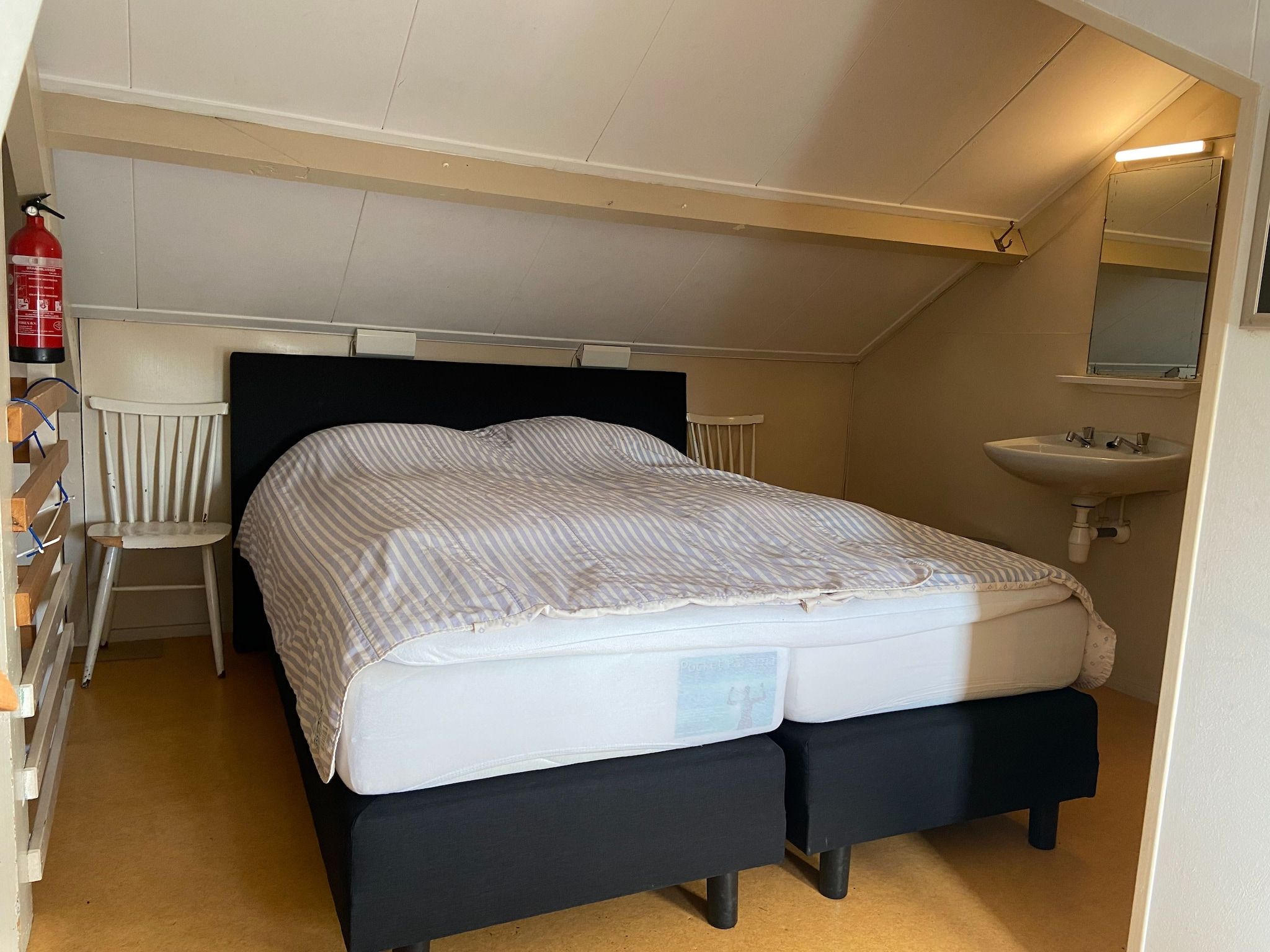 Een slaapkamer van Huis in het bos in Oploo