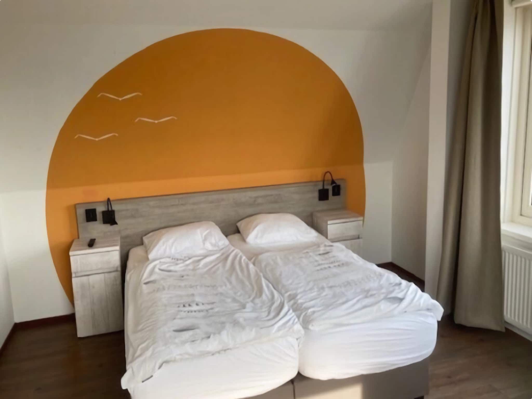 Een slaapkamer van Vakantiepark Duinrust 1 in Noordwijk aan zee