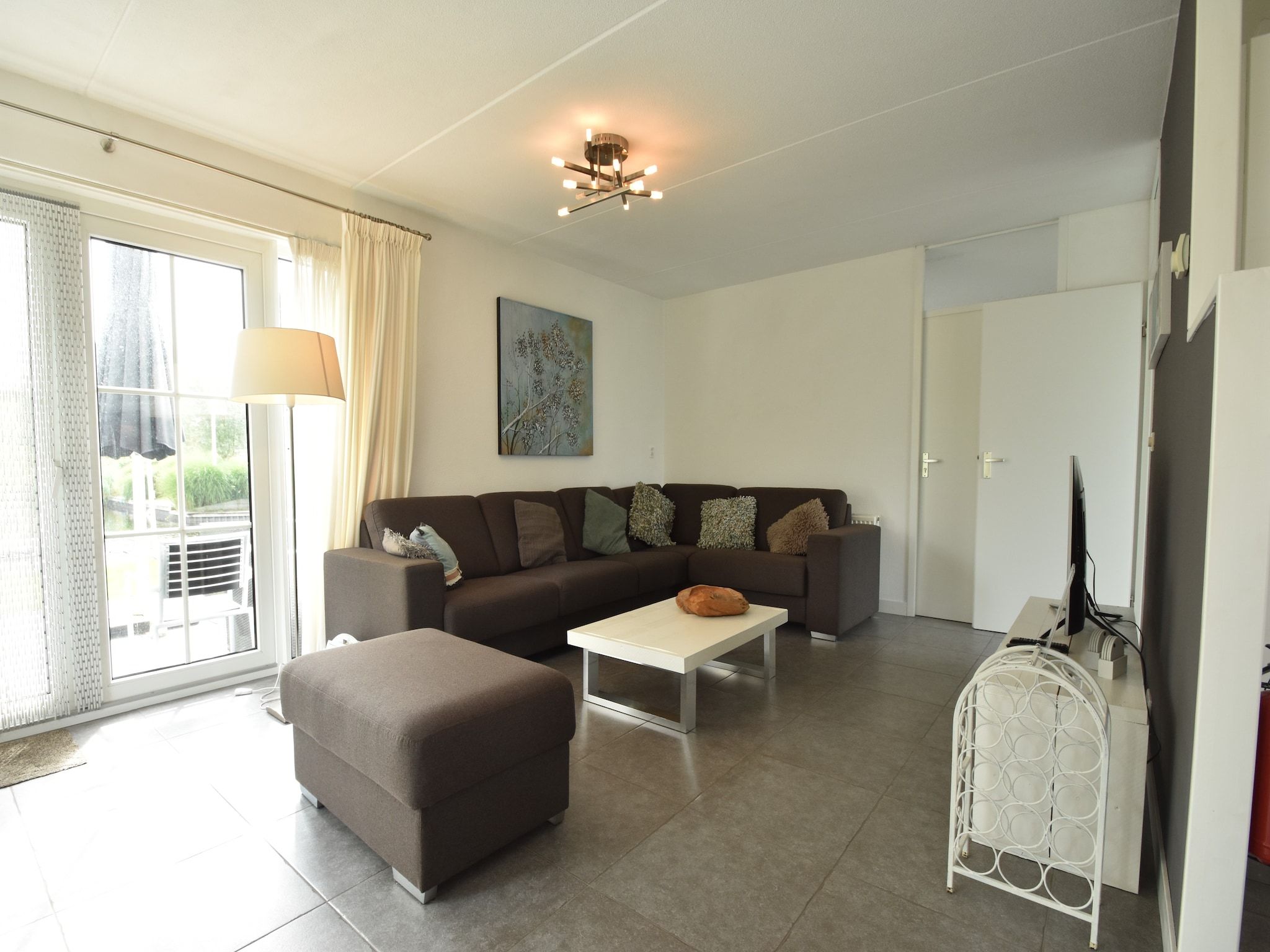 De woonkamer van Wellness aan het Water in Eernewolde in Earnewald